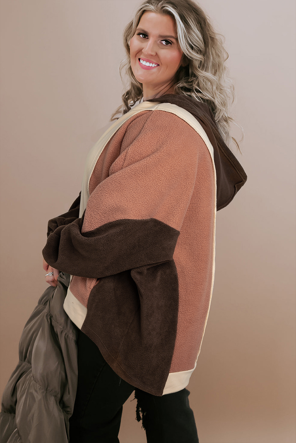 Stay stylish and comfortable with this Plus Size Brown Colorblock Hoodie with Exposed Seams. The eye-catching colorblock design adds a pop of personality to your outfit, while the exposed seams give a trendy edge. Designed to fit fuller body shapes, this hoodie provides a comfortable fit and effortless movement. The perfect blend of fashion and functionality, this plus size sweatshirt effortlessly transitions from casual to chic. Made from a soft blend of 65% polyester and 35% cotton, this hoodie is perfect for everyday wear. Pair it with your favorite jeans or leggings for a cozy and stylish outfit. - Detail View 4 Stay stylish and comfortable with this Plus Size Brown Colorblock Hoodie with Exposed Seams. The eye-catching colorblock design adds a pop of personality to your outfit, while the exposed seams give a trendy edge. Designed to fit fuller body shapes, this hoodie provides a comfortable fit and effortless movement. The perfect blend of fashion and functionality, this plus size sweatshirt effortlessly transitions from casual to chic. Made from a soft blend of 65% polyester and 35% cotton, this hoodie is perfect for everyday wear. Pair it with your favorite jeans or leggings for a cozy and stylish outfit. - Detail View 4