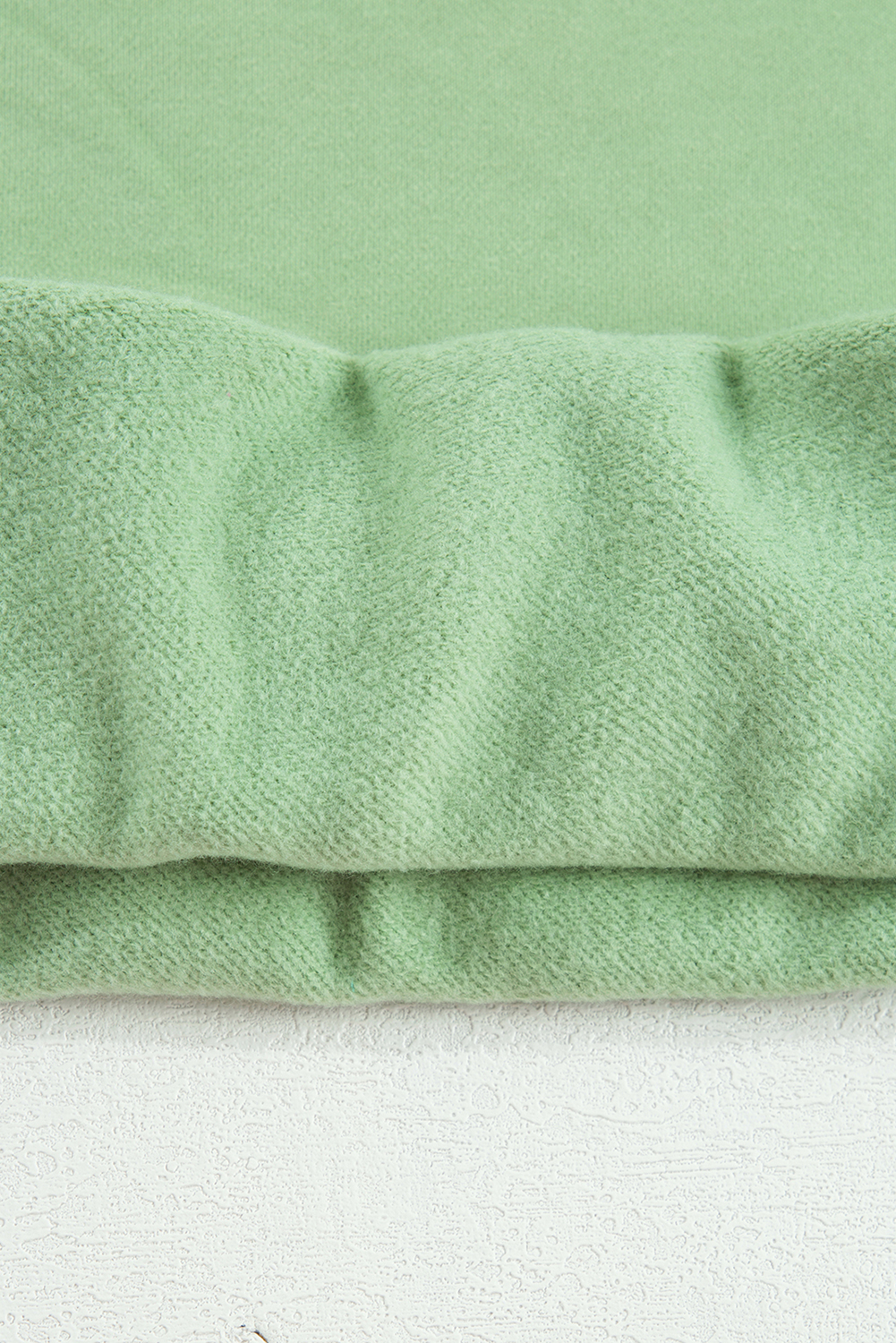 Stay warm and cozy this winter with this Women's Smoke Green Solid Drop Shoulder Fleece Lined Sweatshirt. The simple yet stylish design makes it perfect for versatile wear, while the fleece lining provides extra warmth and comfort in cold weather. The drop shoulder design adds a modern touch, making it a great addition to your winter wardrobe. The long sleeves ensure comfort and warmth, and the solid smoke green color is easy to style with your favorite jeans or leggings. This sweatshirt is a must-have for your cold weather wardrobe, featuring a comfortable and stylish design. - Detail View 14 Stay warm and cozy this winter with this Women's Smoke Green Solid Drop Shoulder Fleece Lined Sweatshirt. The simple yet stylish design makes it perfect for versatile wear, while the fleece lining provides extra warmth and comfort in cold weather. The drop shoulder design adds a modern touch, making it a great addition to your winter wardrobe. The long sleeves ensure comfort and warmth, and the solid smoke green color is easy to style with your favorite jeans or leggings. This sweatshirt is a must-have for your cold weather wardrobe, featuring a comfortable and stylish design. - Detail View 14