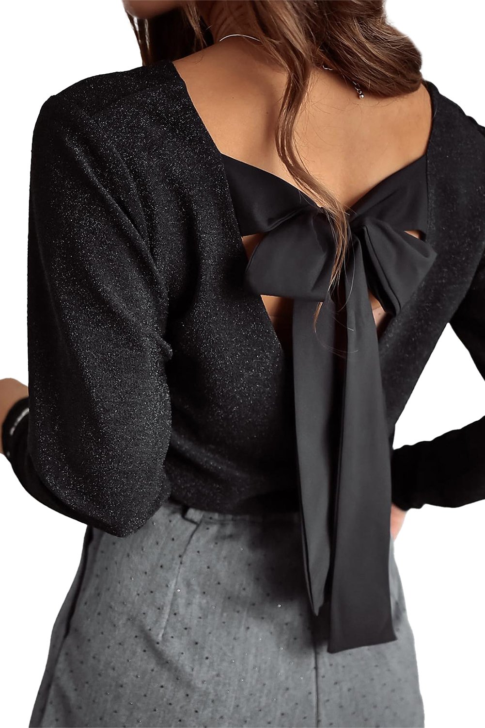 Make a statement with this stunning Women's Metallic Black Bowknot Open Back V Neck Long Sleeve Top. The dazzling metallic sheen and sweet bowknot combine for a whimsical and feminine design. The open back feature adds a subtle yet chic reveal, perfect for a back detail. The V neck design elongates the neck, providing a flattering and sophisticated look. This long sleeve top is ideal for layering and offers year-round versatility. Pair it with high-waisted pants or a flowy skirt for a chic and elegant outfit. This piece is sure to add a touch of glamour to any occasion. - Detail View 19 Make a statement with this stunning Women's Metallic Black Bowknot Open Back V Neck Long Sleeve Top. The dazzling metallic sheen and sweet bowknot combine for a whimsical and feminine design. The open back feature adds a subtle yet chic reveal, perfect for a back detail. The V neck design elongates the neck, providing a flattering and sophisticated look. This long sleeve top is ideal for layering and offers year-round versatility. Pair it with high-waisted pants or a flowy skirt for a chic and elegant outfit. This piece is sure to add a touch of glamour to any occasion. - Detail View 19