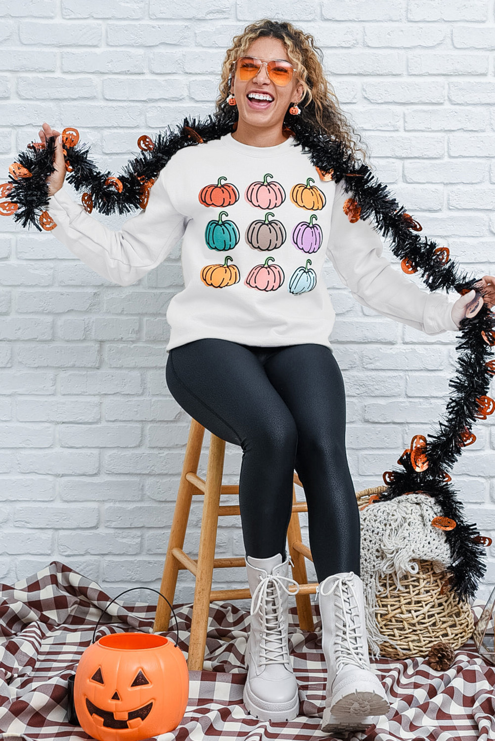 Elevate your fall wardrobe with this Women's Beige Vibrant Pumpkins Print Crew Neck Halloween Sweatshirt. The playful design and lively pumpkin patterns make it a perfect choice for the fall season. The timeless crew neck and dropped shoulders provide a comfortable and classic fit. Made from a blend of 50% polyester and 50% cotton, this sweatshirt ensures both durability and softness. The vibrant pumpkin patterns are ideal for Halloween or autumnal outings, adding a touch of whimsy to your look. Pair it with jeans or casual pants for a complete outfit that's ready to enjoy the season. The long sleeves and cozy fabric keep you snug during cooler weather, making it a versatile and stylish addition to your wardrobe. - Detail View 9 Elevate your fall wardrobe with this Women's Beige Vibrant Pumpkins Print Crew Neck Halloween Sweatshirt. The playful design and lively pumpkin patterns make it a perfect choice for the fall season. The timeless crew neck and dropped shoulders provide a comfortable and classic fit. Made from a blend of 50% polyester and 50% cotton, this sweatshirt ensures both durability and softness. The vibrant pumpkin patterns are ideal for Halloween or autumnal outings, adding a touch of whimsy to your look. Pair it with jeans or casual pants for a complete outfit that's ready to enjoy the season. The long sleeves and cozy fabric keep you snug during cooler weather, making it a versatile and stylish addition to your wardrobe. - Detail View 9