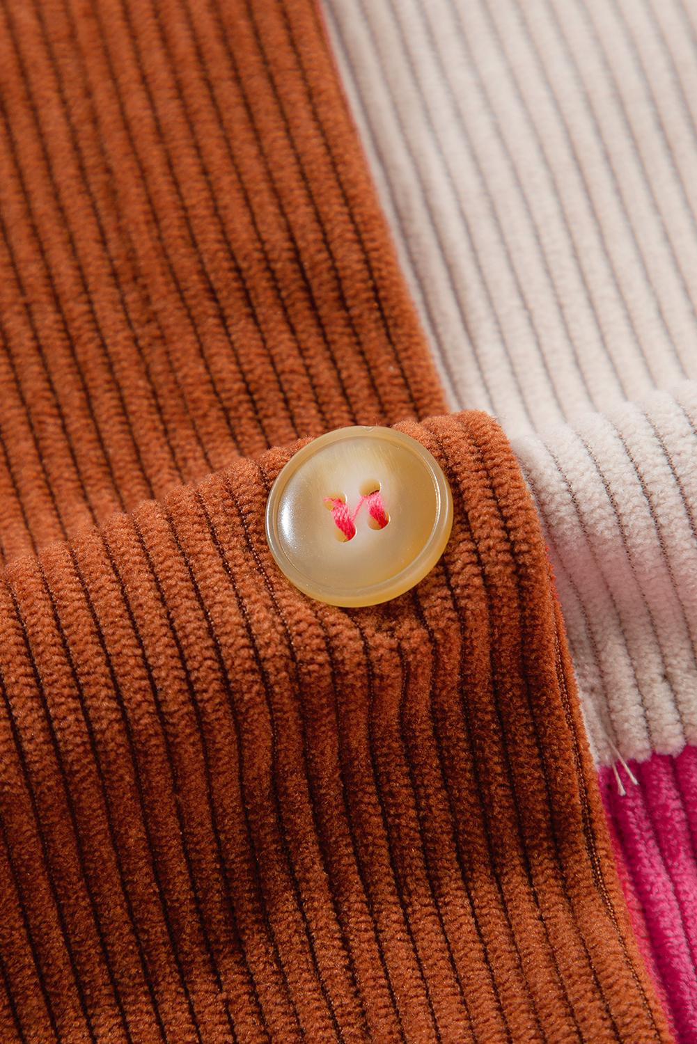 Elevate your winter wardrobe with this Women's Rose Red Colorblock Curved Hem Corduroy Shacket with Pocket. Stay stylish with the trendy color block design that adds a modern touch to your look. The unique patched pocket enhances the shacket with added flair and functionality. Crafted from outstanding corduroy, this shacket ensures durability and long-lasting wear. The curved hem further adds to its unique and fashionable appeal. Perfect for daily wear, this shacket is a versatile addition to your outerwear collection. Made from 95% polyester and 5% elastane, it offers both comfort and style, making it an essential piece for the winter season. - Detail View 14 Elevate your winter wardrobe with this Women's Rose Red Colorblock Curved Hem Corduroy Shacket with Pocket. Stay stylish with the trendy color block design that adds a modern touch to your look. The unique patched pocket enhances the shacket with added flair and functionality. Crafted from outstanding corduroy, this shacket ensures durability and long-lasting wear. The curved hem further adds to its unique and fashionable appeal. Perfect for daily wear, this shacket is a versatile addition to your outerwear collection. Made from 95% polyester and 5% elastane, it offers both comfort and style, making it an essential piece for the winter season. - Detail View 14