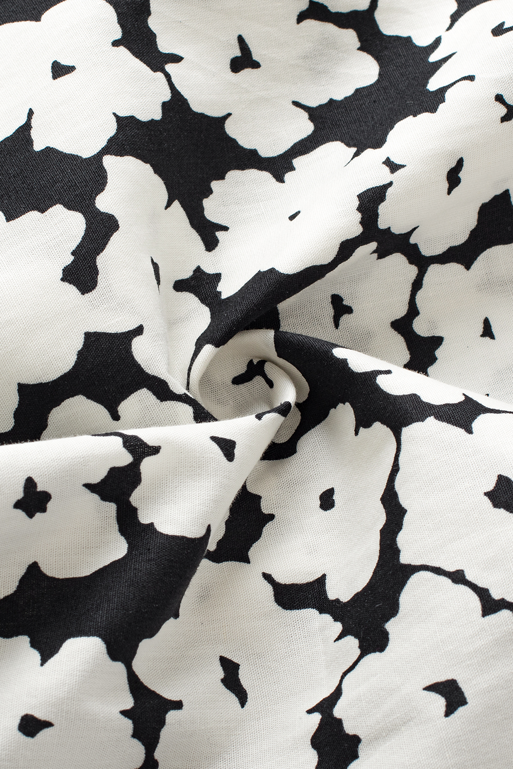 Make a statement with this Women's Black Floral Contrast Ric Rac Layered Ruffle Sleeve Blouse. The floral print, V-neck, and short sleeves with tiered ruffle detail exude femininity and charm. The contrast ric rac trim adds intricate detail, making this blouse delicate and unique. Its exclusive floral pattern makes it a gorgeous and appealing choice for both casual and dressy occasions, allowing you to stand out in style. Made from premium 100% cotton, this blouse ensures comfort and breathability, ideal for the summer season. The black color adds a touch of sophistication and versatility to your wardrobe. Pair it with your favorite bottoms for a chic and trendy look. This stylish blouse with unique patterns and designs is a must-have addition to your collection. - Detail View 9 Make a statement with this Women's Black Floral Contrast Ric Rac Layered Ruffle Sleeve Blouse. The floral print, V-neck, and short sleeves with tiered ruffle detail exude femininity and charm. The contrast ric rac trim adds intricate detail, making this blouse delicate and unique. Its exclusive floral pattern makes it a gorgeous and appealing choice for both casual and dressy occasions, allowing you to stand out in style. Made from premium 100% cotton, this blouse ensures comfort and breathability, ideal for the summer season. The black color adds a touch of sophistication and versatility to your wardrobe. Pair it with your favorite bottoms for a chic and trendy look. This stylish blouse with unique patterns and designs is a must-have addition to your collection. - Detail View 9