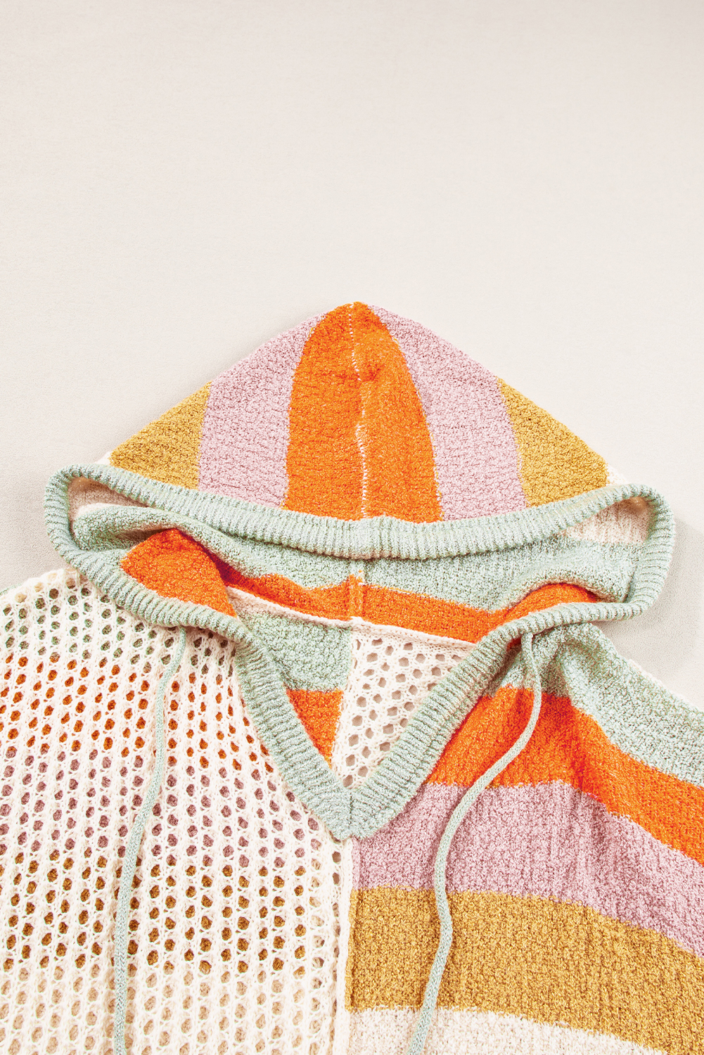 Fall in love with this Women's Beige Oversized Colorblock V-Neck Hooded Sweater, featuring an eye-catching color block and hollowed patchwork design. The relaxed fit style offers both comfort and style, making it a versatile addition to your wardrobe. The V-neck and hooded design add a trendy and faddish touch to the sweater. Made from premium 100% acrylic, this sweater is soft, warm, and perfect for the spring season. Whether it's a date, gathering, party, or daily wear, this sweater is the perfect choice. The solid beige color and color block details make it easy to pair with different bottoms for a variety of stylish looks. Embrace the cozy and chic vibe with this must-have knit sweater. - Detail View 9 Fall in love with this Women's Beige Oversized Colorblock V-Neck Hooded Sweater, featuring an eye-catching color block and hollowed patchwork design. The relaxed fit style offers both comfort and style, making it a versatile addition to your wardrobe. The V-neck and hooded design add a trendy and faddish touch to the sweater. Made from premium 100% acrylic, this sweater is soft, warm, and perfect for the spring season. Whether it's a date, gathering, party, or daily wear, this sweater is the perfect choice. The solid beige color and color block details make it easy to pair with different bottoms for a variety of stylish looks. Embrace the cozy and chic vibe with this must-have knit sweater. - Detail View 9