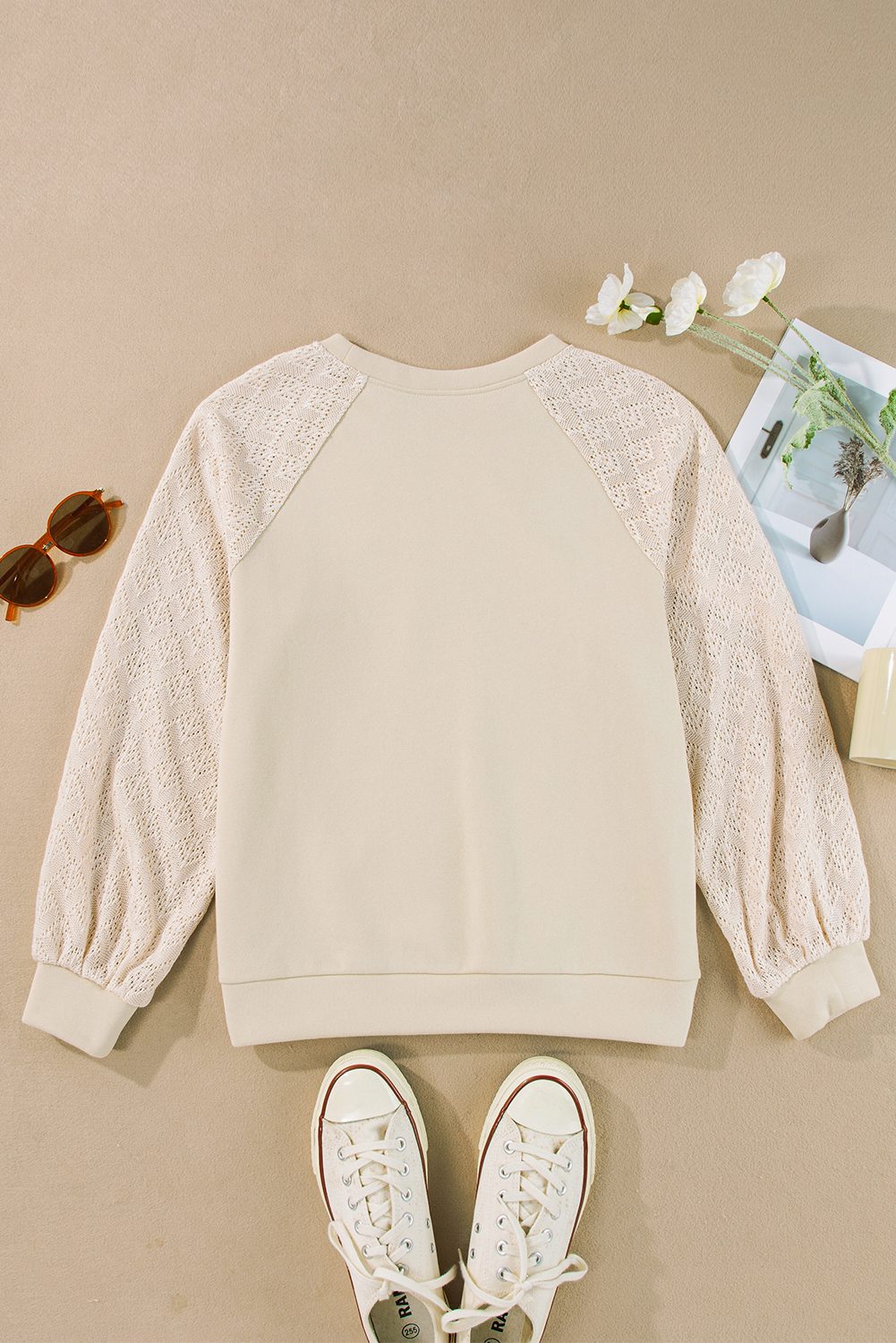 Elevate your casual wardrobe with this timeless and versatile Women's Parchment Eyelet Knit Patchwork Raglan Sleeve Pullover Top. The intricate knit crochet detailing adds a stylish and textured look to the sweatshirt, making it a standout piece in your collection. The raglan sleeves bring a sporty and modern touch, while the flattering regular fit ensures comfort and ease of movement. Made from a premium blend of 50% polyester and 50% cotton, this sweatshirt offers durability and breathability. The solid color and patchwork design make it a contemporary and chic choice for daily wear. Pair it with your favorite jeans or leggings for a trendy and effortless look. This sweatshirt effortlessly elevates your personal style and is a must-have addition to your wardrobe. - Detail View 4 Elevate your casual wardrobe with this timeless and versatile Women's Parchment Eyelet Knit Patchwork Raglan Sleeve Pullover Top. The intricate knit crochet detailing adds a stylish and textured look to the sweatshirt, making it a standout piece in your collection. The raglan sleeves bring a sporty and modern touch, while the flattering regular fit ensures comfort and ease of movement. Made from a premium blend of 50% polyester and 50% cotton, this sweatshirt offers durability and breathability. The solid color and patchwork design make it a contemporary and chic choice for daily wear. Pair it with your favorite jeans or leggings for a trendy and effortless look. This sweatshirt effortlessly elevates your personal style and is a must-have addition to your wardrobe. - Detail View 4