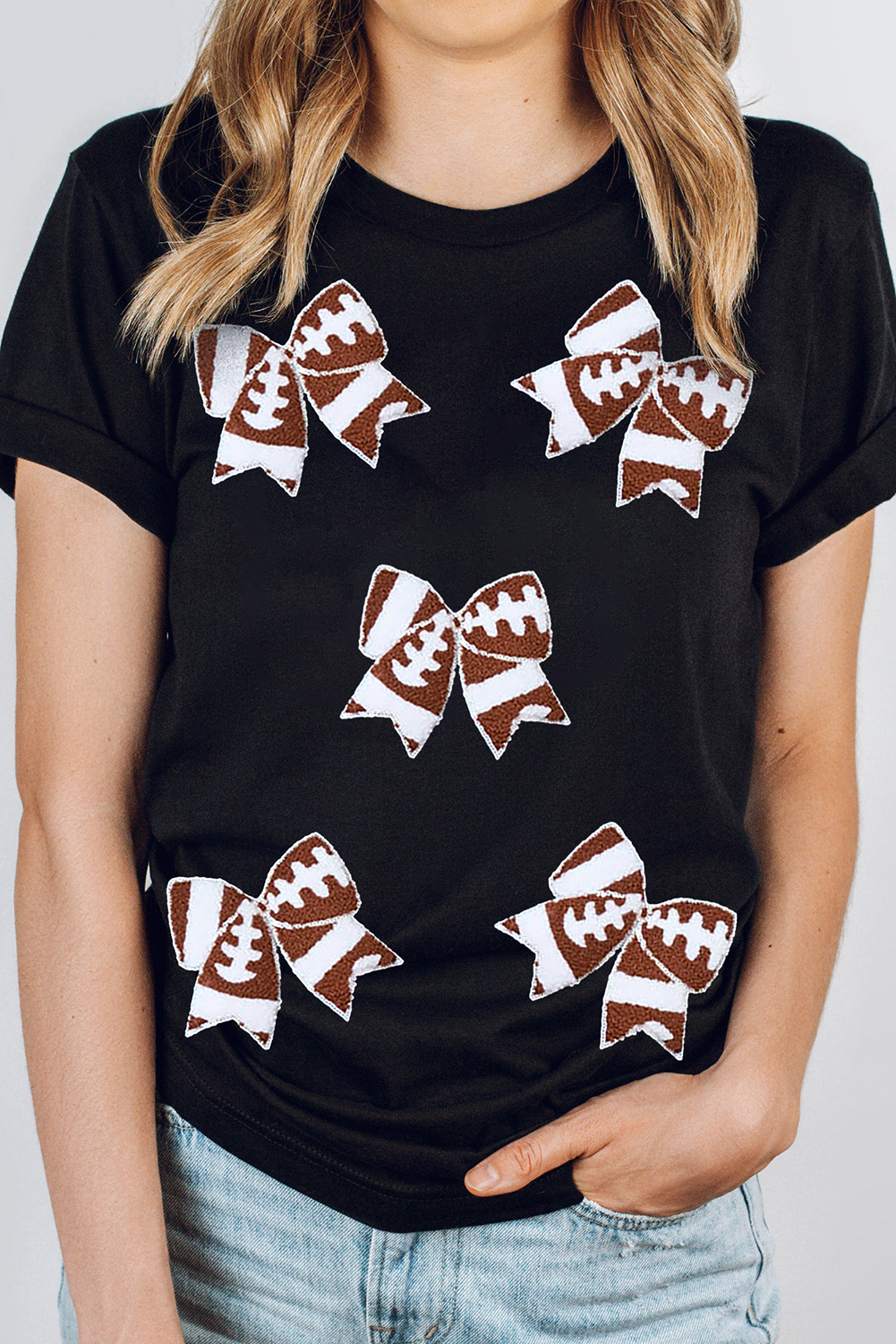 Feminine Football Fan Tee: Black Rugby Bowknot Graphic Tee - Detail View 2 Feminine Football Fan Tee: Black Rugby Bowknot Graphic Tee - Detail View 2