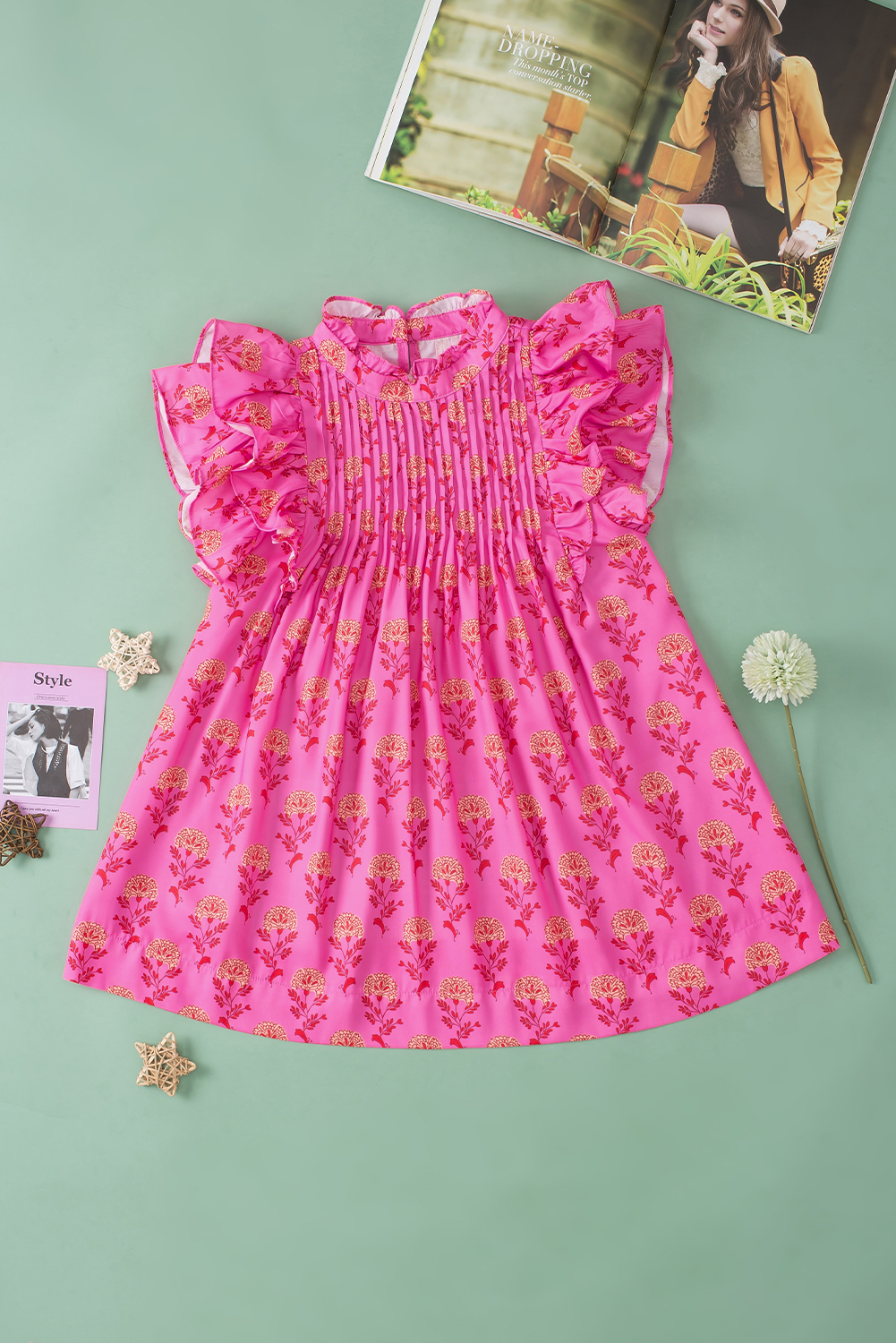 Update your wardrobe with our charming Rose Red Floral Print Pleated Ruffled Flutter Sleeve Blouse. The blouse features a soft and flowing silhouette with flutter sleeves, adding a touch of whimsy and movement. Delicate ruffles adorn the sleeves, giving the garment a soft and feminine touch. The pleating detail adds texture and sophistication to the design, making it a sophisticated and elegant choice for daily wear. Perfect for those who love to add a touch of charm and romance to their outfits. This blouse is a must-have for your wardrobe, offering versatile styles and a romantic flair. - Detail View 9 Update your wardrobe with our charming Rose Red Floral Print Pleated Ruffled Flutter Sleeve Blouse. The blouse features a soft and flowing silhouette with flutter sleeves, adding a touch of whimsy and movement. Delicate ruffles adorn the sleeves, giving the garment a soft and feminine touch. The pleating detail adds texture and sophistication to the design, making it a sophisticated and elegant choice for daily wear. Perfect for those who love to add a touch of charm and romance to their outfits. This blouse is a must-have for your wardrobe, offering versatile styles and a romantic flair. - Detail View 9