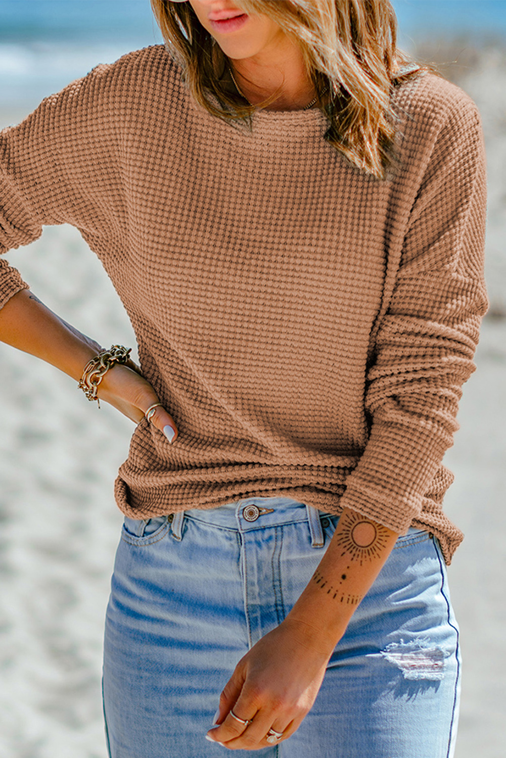 Add a touch of comfort and style to your wardrobe with this Women's Khaki Waffle Knit Drop Shoulder Long Sleeve Top. The fine material of this top ensures exceptional comfort, making it a perfect choice for daily wear. The waffle knit texture adds a high-class and fashionable element to the top, elevating your casual look. The drop shoulder design creates a slouchy and relaxed feel, adding a trendy twist to the overall style. This versatile top pairs perfectly with any bottoms, such as jeans, skirts, or joggers, making it a must-have for your winter wardrobe. The long sleeves make it suitable for all seasons except for summer, providing warmth and style. Made from a premium blend of 95% polyester and 5% elastane, this top ensures durability and a comfortable fit. Embrace the chic and casual appeal of this green long sleeve top for a stylish and effortless look. - Detail View 4 Add a touch of comfort and style to your wardrobe with this Women's Khaki Waffle Knit Drop Shoulder Long Sleeve Top. The fine material of this top ensures exceptional comfort, making it a perfect choice for daily wear. The waffle knit texture adds a high-class and fashionable element to the top, elevating your casual look. The drop shoulder design creates a slouchy and relaxed feel, adding a trendy twist to the overall style. This versatile top pairs perfectly with any bottoms, such as jeans, skirts, or joggers, making it a must-have for your winter wardrobe. The long sleeves make it suitable for all seasons except for summer, providing warmth and style. Made from a premium blend of 95% polyester and 5% elastane, this top ensures durability and a comfortable fit. Embrace the chic and casual appeal of this green long sleeve top for a stylish and effortless look. - Detail View 4