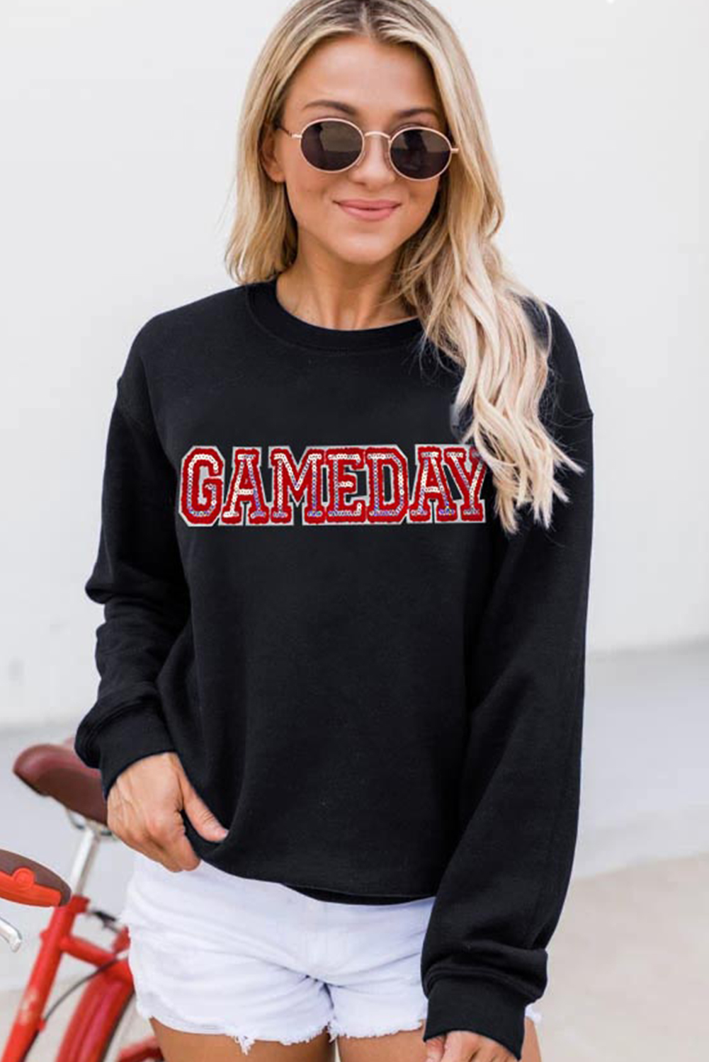Get ready to show off your team spirit with this Women's Black Sequined Game Day Rugby Football Season Sweatshirt. The drop shoulder design creates a relaxed and laid-back silhouette, while the eye-catching sequined letter detailing adds a touch of sparkle and excitement. Perfect for the football season, this sweatshirt is a must-have for any fan. The classic crew neck design offers a comfortable and timeless neckline, and the long sleeves ensure warmth and coverage. This graphic sweatshirt is a great addition to your wardrobe, featuring delicate cuttings and attractive prices. - Detail View 4 Get ready to show off your team spirit with this Women's Black Sequined Game Day Rugby Football Season Sweatshirt. The drop shoulder design creates a relaxed and laid-back silhouette, while the eye-catching sequined letter detailing adds a touch of sparkle and excitement. Perfect for the football season, this sweatshirt is a must-have for any fan. The classic crew neck design offers a comfortable and timeless neckline, and the long sleeves ensure warmth and coverage. This graphic sweatshirt is a great addition to your wardrobe, featuring delicate cuttings and attractive prices. - Detail View 4