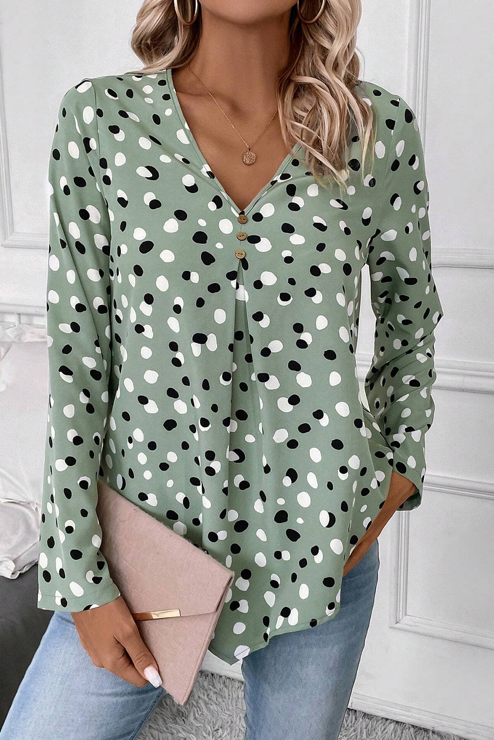 Add a playful and sophisticated touch to your wardrobe with this Women's Green Polka Dot Print Button Front V-Neck Blouse. The polka dot print brings a sweet and playful vibe to the blouse, while the V-neck design with buttons adds a touch of sophistication. Made from premium 100% polyester, this blouse offers durability and a luxurious feel. The tailored fit creates a flattering and feminine silhouette, making it perfect for various occasions. Style it with jeans or skirts for a casual day out, whether it's for a date, shopping, or school. This versatile blouse is a wardrobe essential, perfect for creating polished and professional ensembles. Embrace modern style with this elegant green polka dot blouse. - Detail View 4 Add a playful and sophisticated touch to your wardrobe with this Women's Green Polka Dot Print Button Front V-Neck Blouse. The polka dot print brings a sweet and playful vibe to the blouse, while the V-neck design with buttons adds a touch of sophistication. Made from premium 100% polyester, this blouse offers durability and a luxurious feel. The tailored fit creates a flattering and feminine silhouette, making it perfect for various occasions. Style it with jeans or skirts for a casual day out, whether it's for a date, shopping, or school. This versatile blouse is a wardrobe essential, perfect for creating polished and professional ensembles. Embrace modern style with this elegant green polka dot blouse. - Detail View 4
