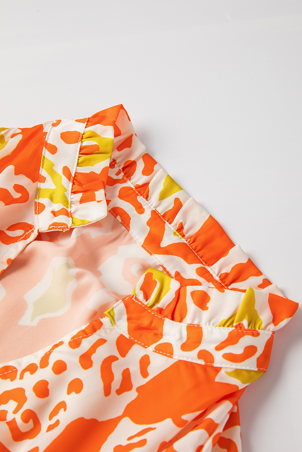 Trendy Leopard Print Blouse: Orange Colorblock Design with Puff Sleeves - Detail View 12 Trendy Leopard Print Blouse: Orange Colorblock Design with Puff Sleeves - Detail View 12
