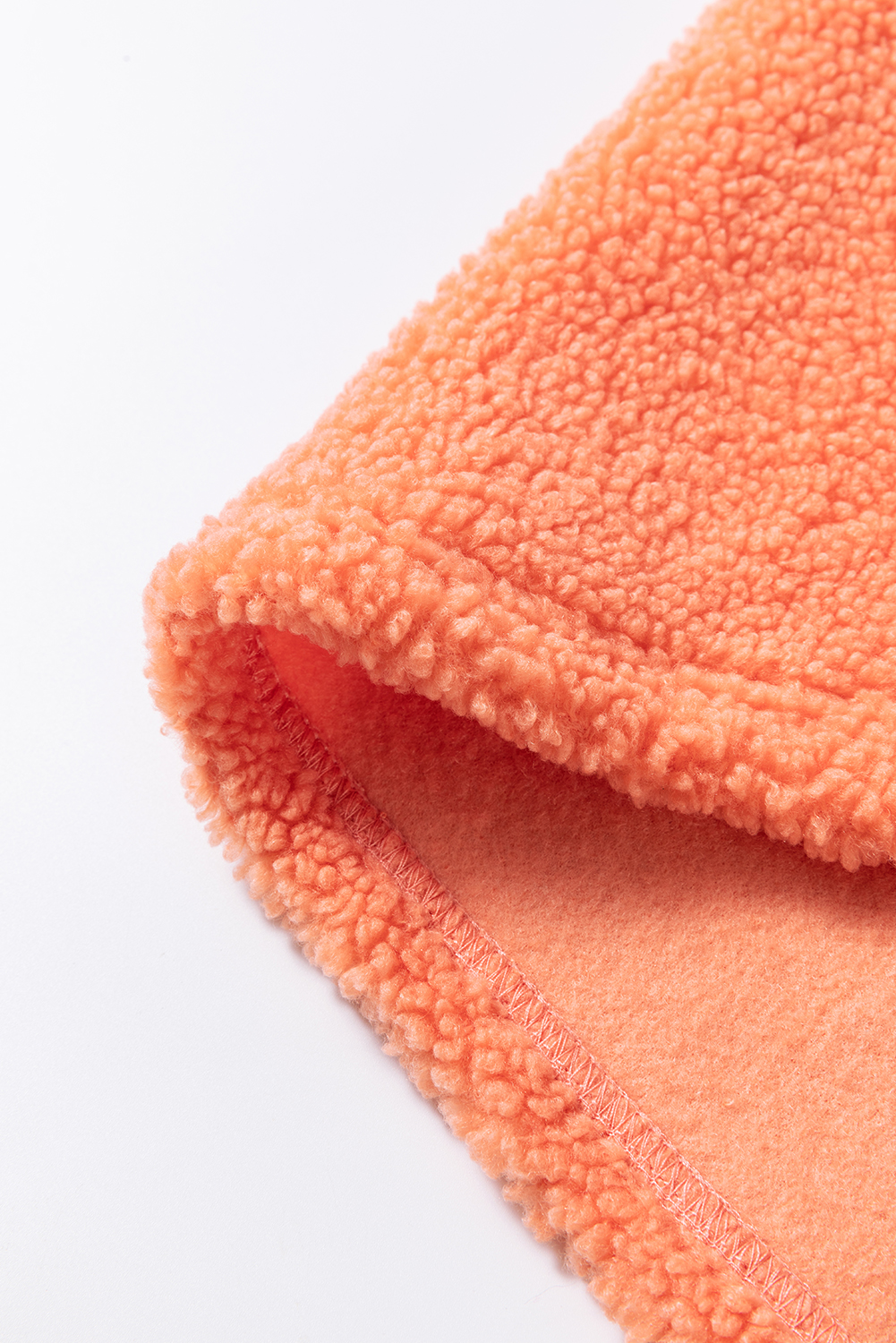 Stay warm and stylish this winter with our Orange Colorblock Half Zipper Stand Neck Sherpa Sweatshirt. The sherpa-trimmed exterior adds a plush and cozy touch, while the color block design creates a fashionable contrast. The half zipper design allows for adjustable warmth, and the stand neck provides extra coverage and a sleek silhouette. Pair this sweatshirt with your favorite jeans or leggings for a cozy and comfortable look. Perfect for outdoor activities, daily wear, or just lounging around. Made from 100% polyester fleece, this sweatshirt is soft, breathable, and easy to care for. - Detail View 14 Stay warm and stylish this winter with our Orange Colorblock Half Zipper Stand Neck Sherpa Sweatshirt. The sherpa-trimmed exterior adds a plush and cozy touch, while the color block design creates a fashionable contrast. The half zipper design allows for adjustable warmth, and the stand neck provides extra coverage and a sleek silhouette. Pair this sweatshirt with your favorite jeans or leggings for a cozy and comfortable look. Perfect for outdoor activities, daily wear, or just lounging around. Made from 100% polyester fleece, this sweatshirt is soft, breathable, and easy to care for. - Detail View 14