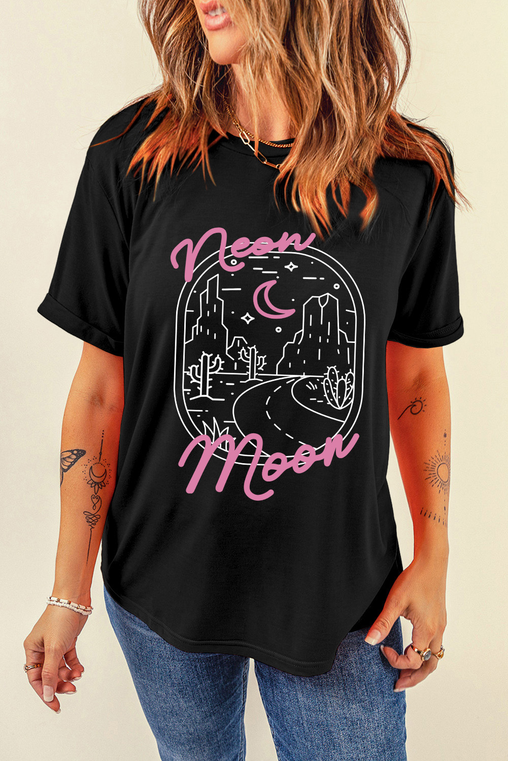 Make a statement with this Women's Black Neon Moon Letter Graphic Short Sleeve Top. The neon moon letter graphic adds a touch of celestial magic to the design, while the delicate desert landscape print brings a unique and trendy touch. The short sleeves and round neck are perfect for warm weather, and can be easily paired with dark denim or leggings to let the graphic take center stage. Graphic tees are versatile and can be dressed up or down for various casual occasions. This top is a must-have for anyone who loves bold and stylish fashion. Made from a comfortable blend of 62% polyester, 32% cotton, and 6% elastane, this graphic tee ensures a smooth and breathable fit. - Detail View 9 Make a statement with this Women's Black Neon Moon Letter Graphic Short Sleeve Top. The neon moon letter graphic adds a touch of celestial magic to the design, while the delicate desert landscape print brings a unique and trendy touch. The short sleeves and round neck are perfect for warm weather, and can be easily paired with dark denim or leggings to let the graphic take center stage. Graphic tees are versatile and can be dressed up or down for various casual occasions. This top is a must-have for anyone who loves bold and stylish fashion. Made from a comfortable blend of 62% polyester, 32% cotton, and 6% elastane, this graphic tee ensures a smooth and breathable fit. - Detail View 9