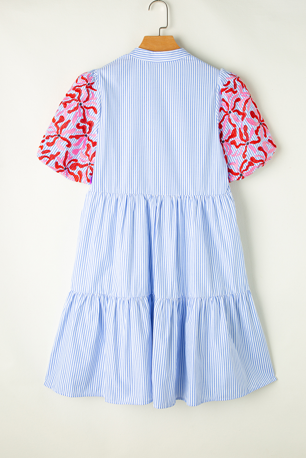Make a statement with this classic Women's Sky Blue Stripe Contrast Floral Puff Sleeve Mini Dress. The tiered ruffles create a dynamic and playful silhouette, while the flattering V neckline adds a touch of elegance. The puff sleeves give a trendy and feminine look, perfect for a chic and casual daily wear. The mini dress is designed to flatter any figure, with a high waist and shifts silhouettes that skim over the body. Made from a soft blend of 65% polyester and 35% cotton, this dress is comfortable and easy to care for. The embroidered details add a beautiful finishing touch to the dress. The sky blue and white striped pattern is both modern and timeless, making it suitable for spring and summer occasions. Pair it with sneakers for a casual look or dress up with heels for a more polished ensemble. This dress is a must-have in your wardrobe, offering a mix of chic and playful styles at an attractive price. - Detail View 9 Make a statement with this classic Women's Sky Blue Stripe Contrast Floral Puff Sleeve Mini Dress. The tiered ruffles create a dynamic and playful silhouette, while the flattering V neckline adds a touch of elegance. The puff sleeves give a trendy and feminine look, perfect for a chic and casual daily wear. The mini dress is designed to flatter any figure, with a high waist and shifts silhouettes that skim over the body. Made from a soft blend of 65% polyester and 35% cotton, this dress is comfortable and easy to care for. The embroidered details add a beautiful finishing touch to the dress. The sky blue and white striped pattern is both modern and timeless, making it suitable for spring and summer occasions. Pair it with sneakers for a casual look or dress up with heels for a more polished ensemble. This dress is a must-have in your wardrobe, offering a mix of chic and playful styles at an attractive price. - Detail View 9