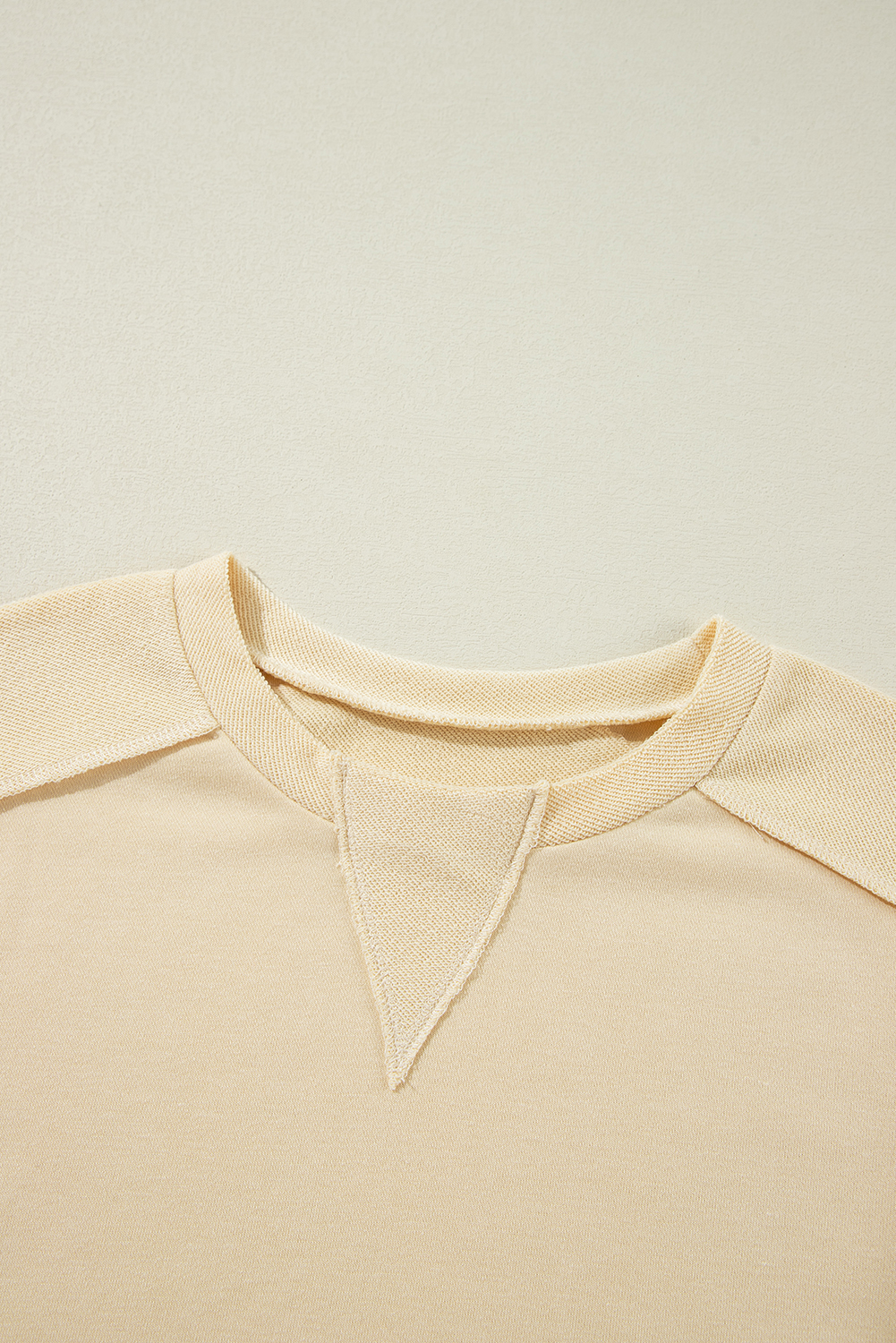 Stay warm and stylish all year round with this Women's Beige Splicing Round Neck Pullover Sweatshirt. The plain design offers a sleek and polished look, while the round neck and relaxed fit create a timeless silhouette. The splicing details add a touch of uniqueness to the solid beige color, making this sweatshirt a fashionable choice for daily wear. The pullover style ensures ease of wear, and the soft and warm material ensures comfortable wear. This sweatshirt is a must-have addition to your wardrobe, perfect for casual fall and autumn wear. - Detail View 9 Stay warm and stylish all year round with this Women's Beige Splicing Round Neck Pullover Sweatshirt. The plain design offers a sleek and polished look, while the round neck and relaxed fit create a timeless silhouette. The splicing details add a touch of uniqueness to the solid beige color, making this sweatshirt a fashionable choice for daily wear. The pullover style ensures ease of wear, and the soft and warm material ensures comfortable wear. This sweatshirt is a must-have addition to your wardrobe, perfect for casual fall and autumn wear. - Detail View 9