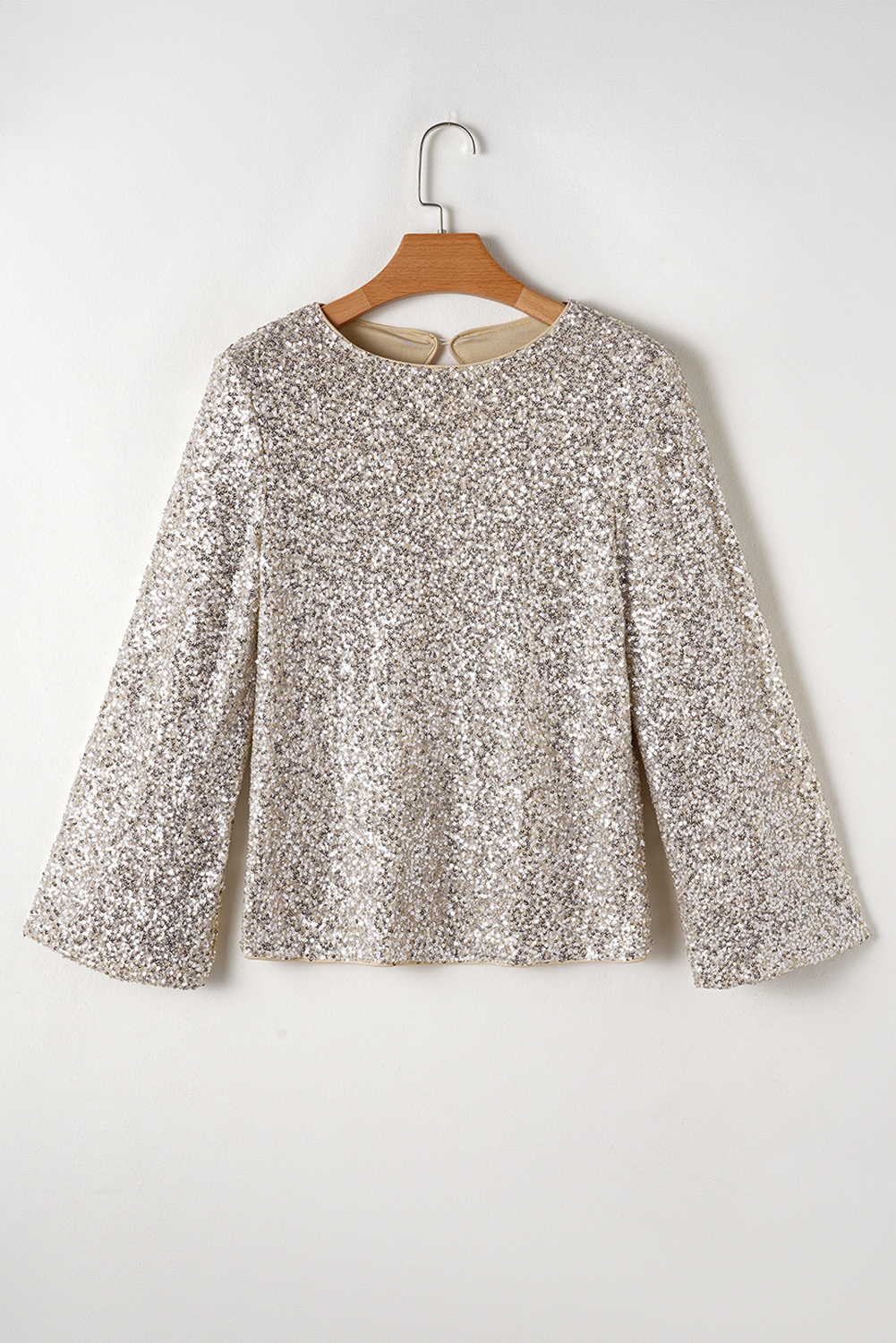 Make a statement with this glamorous Women's Silvery Sequin Puff Sleeve Cutout Back Blouse. The shiny sequins on the puff sleeves add volume and sparkle, while the cutout back design offers a daring yet elegant touch. Perfect for turning heads, this blouse is a great choice for special occasions, such as parties or nightclub events. Pair it with tailored bottoms or a skirt for a polished look. With its luxurious feel and flattering fit, this blouse is sure to elevate your style and confidence. You'll feel like a superstar in this stunning silvery sequin blouse. - Detail View 9 Make a statement with this glamorous Women's Silvery Sequin Puff Sleeve Cutout Back Blouse. The shiny sequins on the puff sleeves add volume and sparkle, while the cutout back design offers a daring yet elegant touch. Perfect for turning heads, this blouse is a great choice for special occasions, such as parties or nightclub events. Pair it with tailored bottoms or a skirt for a polished look. With its luxurious feel and flattering fit, this blouse is sure to elevate your style and confidence. You'll feel like a superstar in this stunning silvery sequin blouse. - Detail View 9