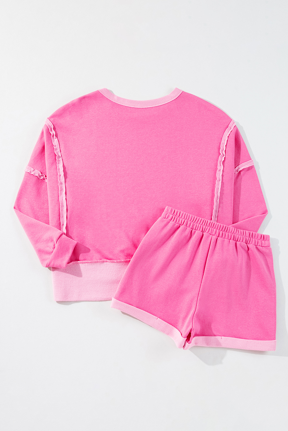 Trendy Two-Piece Set: Sachet Pink Long Sleeve Top with High Low Hem and Shorts - Detail View 6 Trendy Two-Piece Set: Sachet Pink Long Sleeve Top with High Low Hem and Shorts - Detail View 6