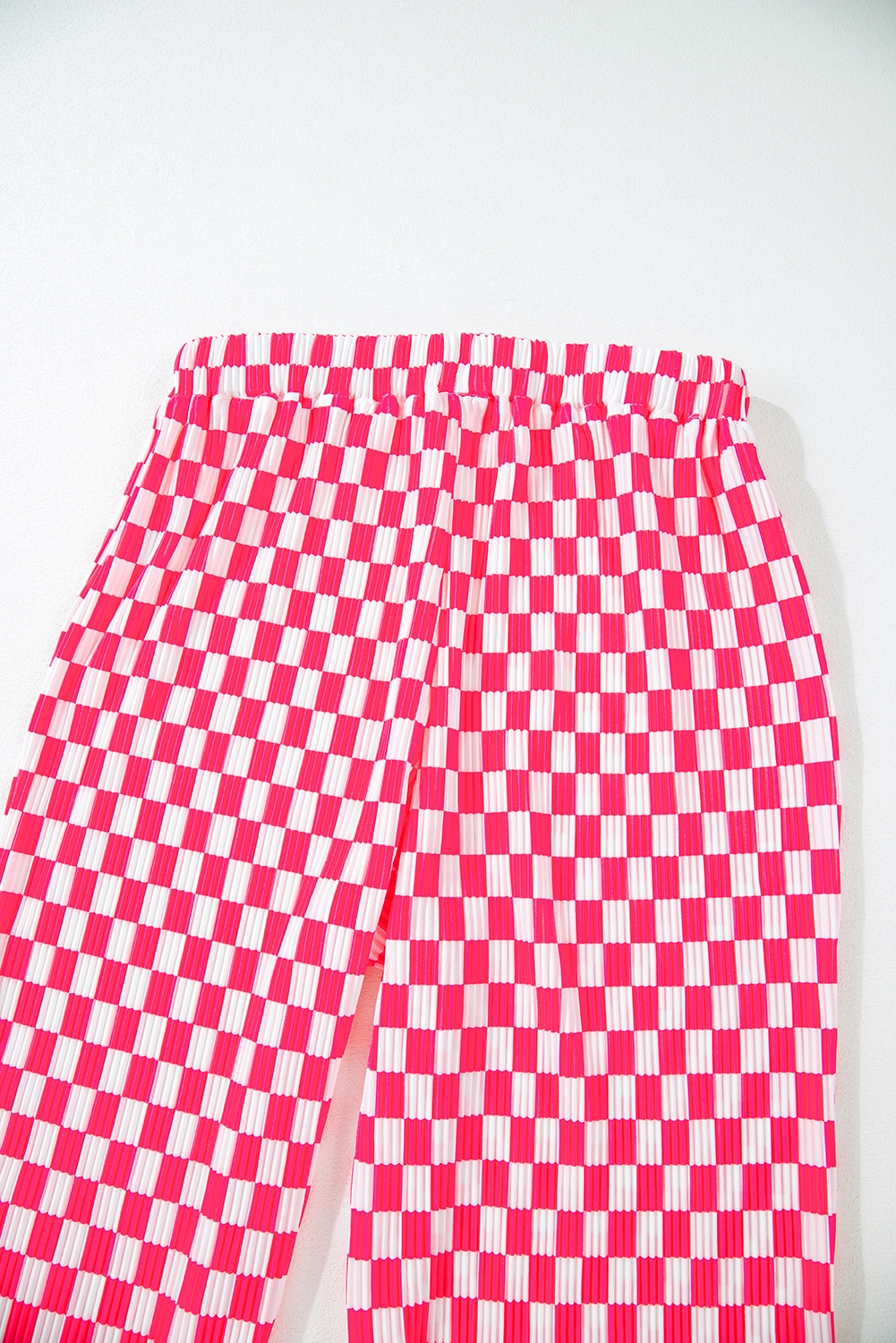 Indulge in the comfort and style of this Pink Checkered Buttoned Shirt and High Waist Pants Pajama Set. The classic checkered pattern in pink adds a touch of sophistication to your daily attire. The long-sleeve buttoned shirt provides a versatile styling option, while the high waist pants flatter the figure and elongate the legs. Perfect for lounging around or running errands, this pajama set is ideal for creating a polished and chic outfit. The 100% polyester fabric ensures durability and ease of care. Slip into something comfortable and stylish with this pink checkered pajama set for women. - Detail View 19 Indulge in the comfort and style of this Pink Checkered Buttoned Shirt and High Waist Pants Pajama Set. The classic checkered pattern in pink adds a touch of sophistication to your daily attire. The long-sleeve buttoned shirt provides a versatile styling option, while the high waist pants flatter the figure and elongate the legs. Perfect for lounging around or running errands, this pajama set is ideal for creating a polished and chic outfit. The 100% polyester fabric ensures durability and ease of care. Slip into something comfortable and stylish with this pink checkered pajama set for women. - Detail View 19