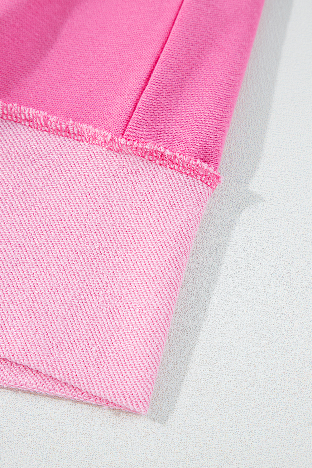 Trendy Two-Piece Set: Sachet Pink Long Sleeve Top with High Low Hem and Shorts - Detail View 10 Trendy Two-Piece Set: Sachet Pink Long Sleeve Top with High Low Hem and Shorts - Detail View 10