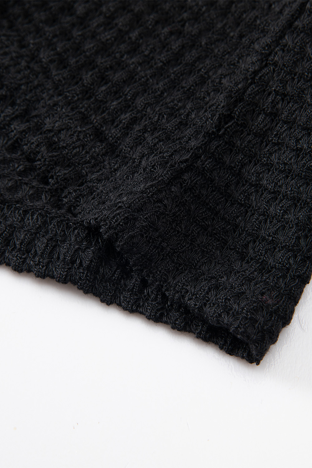 Elevate your casual wardrobe with this chic and comfy Women's Black Waffle Knit Drop Shoulder Long Sleeve Top. Crafted from a fine blend of 95% polyester and 5% elastane, this top ensures exceptional comfort and a luxurious feel. The waffle knit texture adds a touch of sophistication and fashion-forward style to the top. The drop shoulder design gives it a slouchy, relaxed feel, perfect for creating effortless and trendy looks. This versatile top pairs perfectly with any bottoms, such as jeans, skirts, or joggers, making it a must-have for your wardrobe. The long sleeves make it suitable for all seasons except for summer, providing you with stylish comfort year-round. Add this black waffle knit top to your collection for a versatile and fashionable addition to your daily wear. - Detail View 9 Elevate your casual wardrobe with this chic and comfy Women's Black Waffle Knit Drop Shoulder Long Sleeve Top. Crafted from a fine blend of 95% polyester and 5% elastane, this top ensures exceptional comfort and a luxurious feel. The waffle knit texture adds a touch of sophistication and fashion-forward style to the top. The drop shoulder design gives it a slouchy, relaxed feel, perfect for creating effortless and trendy looks. This versatile top pairs perfectly with any bottoms, such as jeans, skirts, or joggers, making it a must-have for your wardrobe. The long sleeves make it suitable for all seasons except for summer, providing you with stylish comfort year-round. Add this black waffle knit top to your collection for a versatile and fashionable addition to your daily wear. - Detail View 9