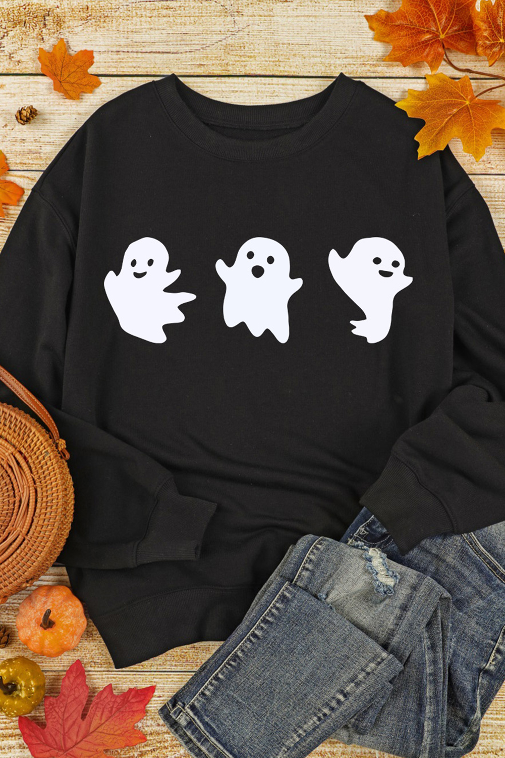 Embrace the festive spirit of Halloween with this Women's Black Halloween Ghosts Print Round Neck Sweatshirt. Stand out with the playful ghost design that captures the essence of Halloween, adding a touch of fun to your wardrobe. The classic crew neck and long sleeves make it a cozy and comfortable choice for casual outings during the fall and autumn seasons. Made from a premium blend of 50% polyester and 50% cotton, this sweatshirt ensures durability and breathability. The black color adds a chic and versatile touch, allowing you to easily pair it with your favorite bottoms. Enjoy the versatility of the long sleeves, ideal for layering on cooler days or wearing on its own during warmer weather. This graphic sweatshirt is the perfect combination of chic and casual, adding a trendy and festive vibe to your daily outfits. - Detail View 14 Embrace the festive spirit of Halloween with this Women's Black Halloween Ghosts Print Round Neck Sweatshirt. Stand out with the playful ghost design that captures the essence of Halloween, adding a touch of fun to your wardrobe. The classic crew neck and long sleeves make it a cozy and comfortable choice for casual outings during the fall and autumn seasons. Made from a premium blend of 50% polyester and 50% cotton, this sweatshirt ensures durability and breathability. The black color adds a chic and versatile touch, allowing you to easily pair it with your favorite bottoms. Enjoy the versatility of the long sleeves, ideal for layering on cooler days or wearing on its own during warmer weather. This graphic sweatshirt is the perfect combination of chic and casual, adding a trendy and festive vibe to your daily outfits. - Detail View 14