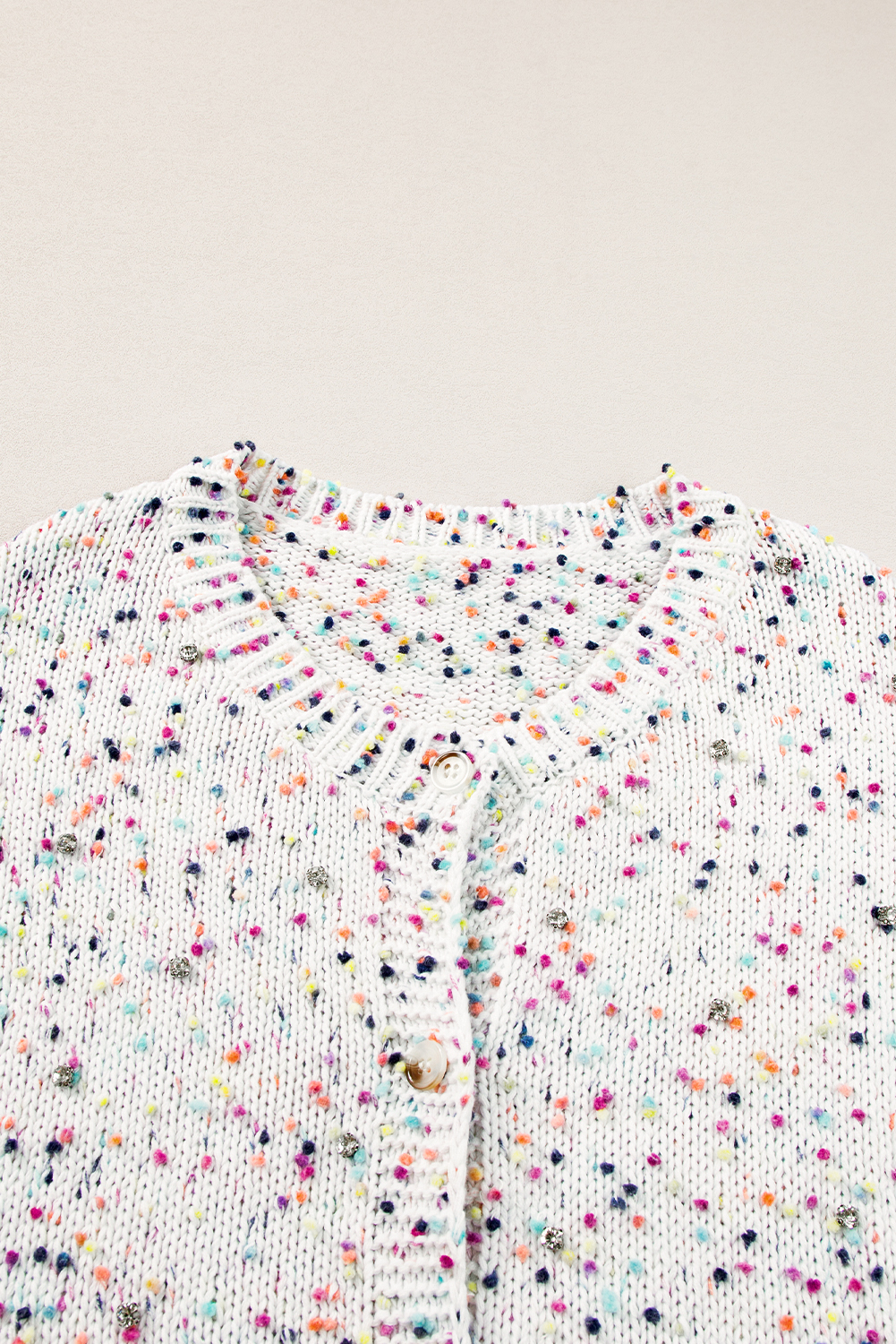 Elevate your winter wardrobe with this Women's White Multicolor Confetti Sweater Cardigan. The sweet and stylish multicolor confetti pattern adds a playful touch to the cardigan, making it a trendy and eye-catching piece. The sweater style with button front closure is easy to dress up or down, offering versatility for various occasions. Its flattering fit is designed to showcase your figure in a flattering way, making you feel confident in public. Made from a premium blend of 43% cotton, 29% acrylic, 22% polyester, and 6% polyamide, this cardigan ensures both comfort and durability. The white color and solid pattern make it easy to pair with jeans and skirts, creating a chic and fashionable look. This cardigan is a must-have for the coming fall, offering the latest fashion trends and ensuring you stay cozy and stylish. - Detail View 9 Elevate your winter wardrobe with this Women's White Multicolor Confetti Sweater Cardigan. The sweet and stylish multicolor confetti pattern adds a playful touch to the cardigan, making it a trendy and eye-catching piece. The sweater style with button front closure is easy to dress up or down, offering versatility for various occasions. Its flattering fit is designed to showcase your figure in a flattering way, making you feel confident in public. Made from a premium blend of 43% cotton, 29% acrylic, 22% polyester, and 6% polyamide, this cardigan ensures both comfort and durability. The white color and solid pattern make it easy to pair with jeans and skirts, creating a chic and fashionable look. This cardigan is a must-have for the coming fall, offering the latest fashion trends and ensuring you stay cozy and stylish. - Detail View 9