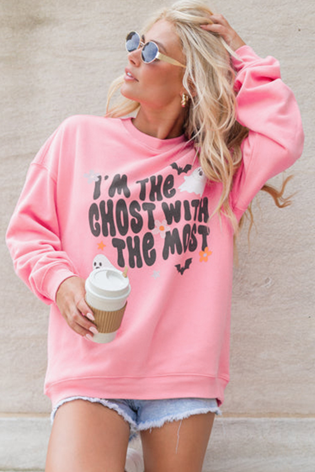 Get ready for a spook-tacular Halloween with this Women's Cozy Pink Halloween Slogan Ghost Bat Graphic Drop Shoulder Sweatshirt. The fun and eerie slogan and ghost graphic add a playful touch, while the drop shoulders and crew neck ensure a comfortable fit for everyday wear. Made from a soft blend of 50% polyester and 50% cotton, this sweatshirt is designed to keep you cozy and warm all autumn long. Pair it with leggings or jeans for a stylish and comfortable outfit, perfect for Halloween parties, autumn nights, or just lounging around. This graphic sweatshirt is a must-have for your Halloween wardrobe, offering both fashion and comfort. - Detail View 4 Get ready for a spook-tacular Halloween with this Women's Cozy Pink Halloween Slogan Ghost Bat Graphic Drop Shoulder Sweatshirt. The fun and eerie slogan and ghost graphic add a playful touch, while the drop shoulders and crew neck ensure a comfortable fit for everyday wear. Made from a soft blend of 50% polyester and 50% cotton, this sweatshirt is designed to keep you cozy and warm all autumn long. Pair it with leggings or jeans for a stylish and comfortable outfit, perfect for Halloween parties, autumn nights, or just lounging around. This graphic sweatshirt is a must-have for your Halloween wardrobe, offering both fashion and comfort. - Detail View 4