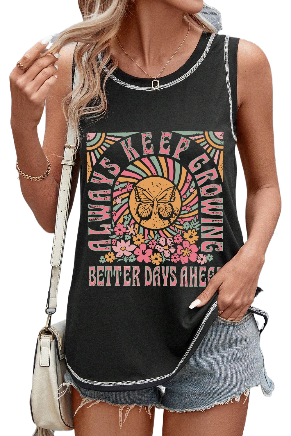 Indulge in a garden of delights for the eyes with this Women's Black Letters Butterfly Floral Printed Stitching Crewneck Tank Top. The tank top features fluttering butterflies and floral prints that add a whimsical and charming touch to your outfit. The crew neck style is perfect for layering or wearing on its own, offering versatility in styling. The stitching details enhance the design, giving it an artisanal feel and adding a unique touch to the top. Made from a comfortable blend of 65% polyester, 30% viscose, and 5% elastane, this tank top ensures a comfortable and breathable fit. The black color and stylish prints make it an ideal choice for a casual summer look. Pair it with your favorite shorts or jeans for a trendy and effortless ensemble. This graphic tank top is a must-have addition to your summer wardrobe, offering both style and comfort. - Detail View 4 Indulge in a garden of delights for the eyes with this Women's Black Letters Butterfly Floral Printed Stitching Crewneck Tank Top. The tank top features fluttering butterflies and floral prints that add a whimsical and charming touch to your outfit. The crew neck style is perfect for layering or wearing on its own, offering versatility in styling. The stitching details enhance the design, giving it an artisanal feel and adding a unique touch to the top. Made from a comfortable blend of 65% polyester, 30% viscose, and 5% elastane, this tank top ensures a comfortable and breathable fit. The black color and stylish prints make it an ideal choice for a casual summer look. Pair it with your favorite shorts or jeans for a trendy and effortless ensemble. This graphic tank top is a must-have addition to your summer wardrobe, offering both style and comfort. - Detail View 4