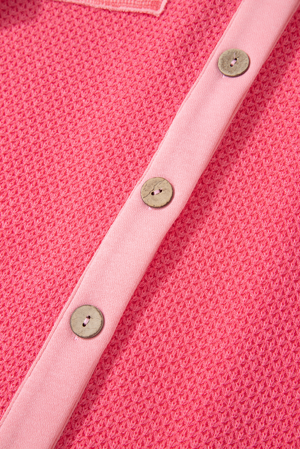 Stay warm and stylish with this Women's Peach Blossom Two Tone Waffle Knit Buttoned Shacket. The two-tone design adds a modern twist to your outfit, while the waffle knit texture provides a cozy and stylish look. The easy-to-use button closure ensures convenience, and the loose fit offers a relaxed and comfortable feel. This shacket is perfect for layering in cold weather, making it an essential addition to your fall and autumn wardrobe. Pair it with jeans and boots for a chic and effortless look. Made from a soft and durable blend of 90% polyester, 7% acrylic, and 3% elastane, this shacket ensures both comfort and long-lasting wear. - Detail View 9 Stay warm and stylish with this Women's Peach Blossom Two Tone Waffle Knit Buttoned Shacket. The two-tone design adds a modern twist to your outfit, while the waffle knit texture provides a cozy and stylish look. The easy-to-use button closure ensures convenience, and the loose fit offers a relaxed and comfortable feel. This shacket is perfect for layering in cold weather, making it an essential addition to your fall and autumn wardrobe. Pair it with jeans and boots for a chic and effortless look. Made from a soft and durable blend of 90% polyester, 7% acrylic, and 3% elastane, this shacket ensures both comfort and long-lasting wear. - Detail View 9