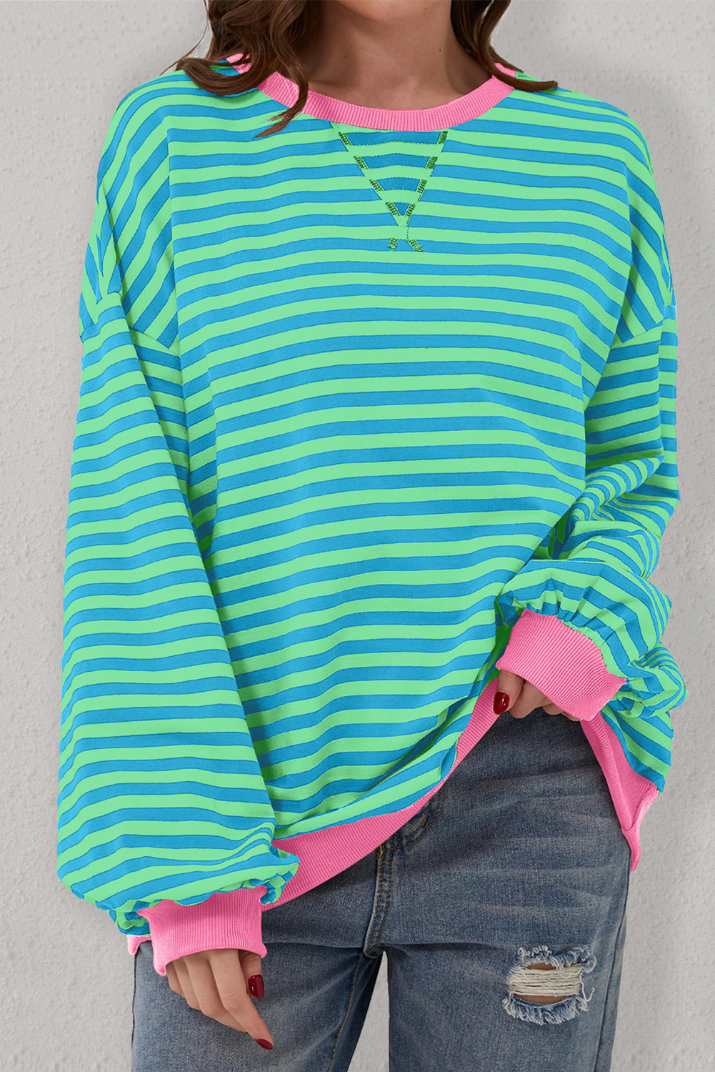 Elevate your casual wardrobe with this timeless and classic Women's Sky Blue Stripe Oversized Contrast Trim Pullover Sweatshirt. The sweatshirt features a timeless striped pattern and a casual, slouchy vibe with its oversized style and drop shoulder design. The contrast trim adds a pop of color and visual interest to this pullover, making it a stylish choice for daily wear. Made from a comfortable blend of 95% cotton and 5% elastane, this sweatshirt offers a very relaxed fit, suitable for different body shapes. The long sleeves and round neck make it a versatile and essential addition to your spring wardrobe. Stay on-trend with this sweatshirt that combines comfort and style effortlessly. - Detail View 4 Elevate your casual wardrobe with this timeless and classic Women's Sky Blue Stripe Oversized Contrast Trim Pullover Sweatshirt. The sweatshirt features a timeless striped pattern and a casual, slouchy vibe with its oversized style and drop shoulder design. The contrast trim adds a pop of color and visual interest to this pullover, making it a stylish choice for daily wear. Made from a comfortable blend of 95% cotton and 5% elastane, this sweatshirt offers a very relaxed fit, suitable for different body shapes. The long sleeves and round neck make it a versatile and essential addition to your spring wardrobe. Stay on-trend with this sweatshirt that combines comfort and style effortlessly. - Detail View 4