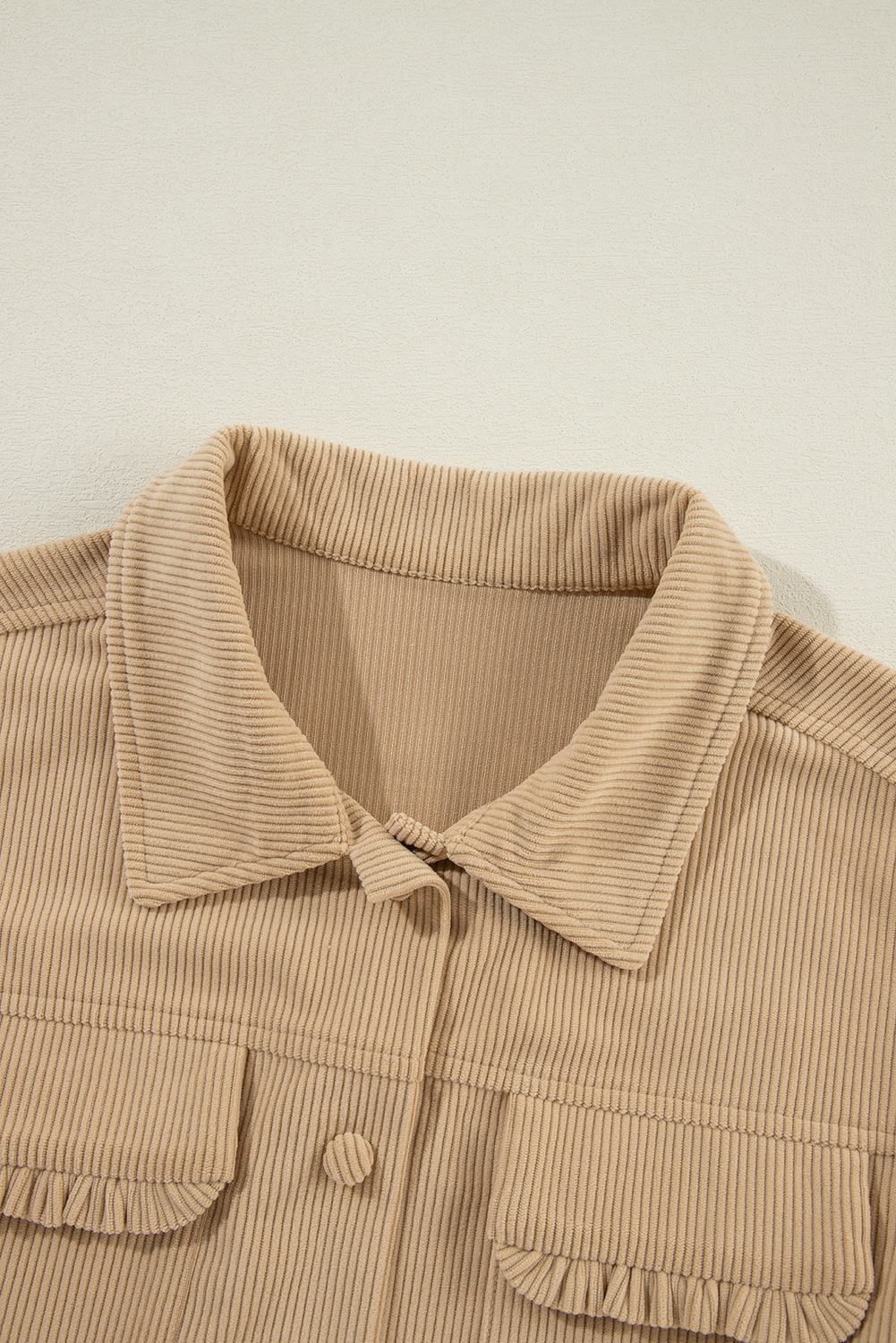 Add a bold and versatile staple to your wardrobe with this Women's Light French Beige Solid Frilled Flap Pocket Button Up Corduroy Shacket. Crafted from luxurious 100% polyester corduroy fabric, this jacket provides a soft and textured feel, perfect for the winter season. The convenient button-up closure ensures easy wear and styling, while the classic shirt collar adds a touch of sophistication to your look. The solid light French beige color makes it a versatile piece that can be dressed up or down for various occasions. The frilled flap pocket detail adds a unique and charming touch to the jacket. Whether you're going for a casual or elegant look, this corduroy shacket is a must-have addition to your outerwear collection, offering captivating patterns and textures. - Detail View 9 Add a bold and versatile staple to your wardrobe with this Women's Light French Beige Solid Frilled Flap Pocket Button Up Corduroy Shacket. Crafted from luxurious 100% polyester corduroy fabric, this jacket provides a soft and textured feel, perfect for the winter season. The convenient button-up closure ensures easy wear and styling, while the classic shirt collar adds a touch of sophistication to your look. The solid light French beige color makes it a versatile piece that can be dressed up or down for various occasions. The frilled flap pocket detail adds a unique and charming touch to the jacket. Whether you're going for a casual or elegant look, this corduroy shacket is a must-have addition to your outerwear collection, offering captivating patterns and textures. - Detail View 9