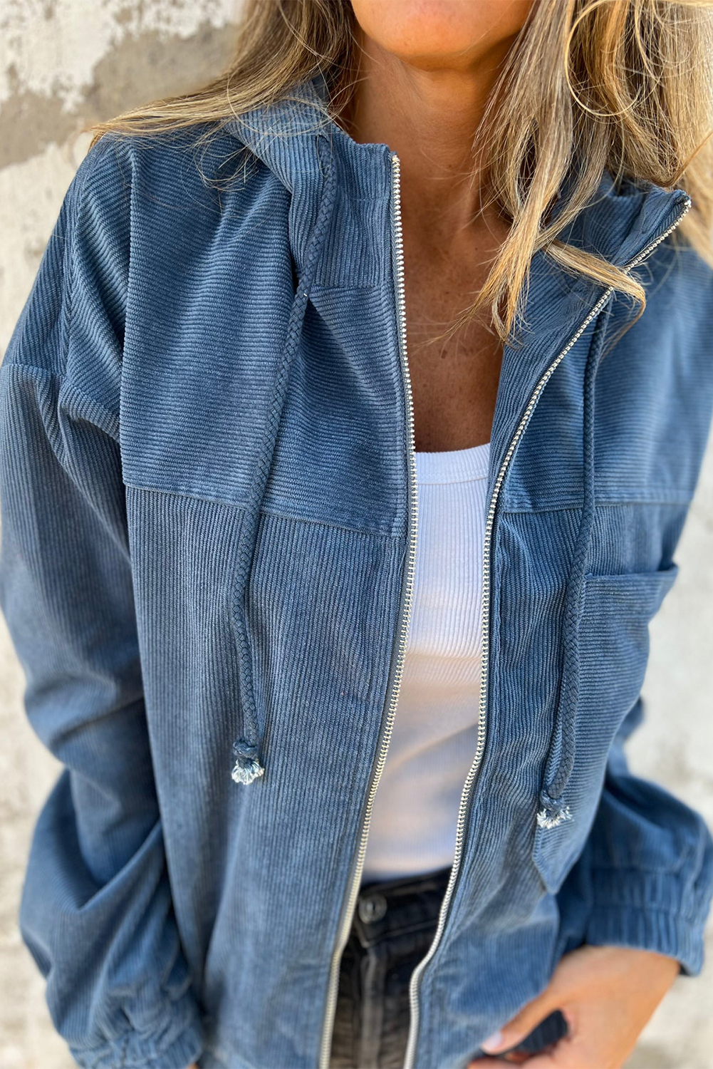 Add a touch of vintage trendiness to your outerwear collection with this Women's Real Teal Corduroy Drawstring Hooded Zip-Up Jacket. The corduroy fabric gives the jacket a trendy vintage look, while the hooded design with a drawstring offers both style and function. The functional zip-up feature ensures easy wearability and adds to the jacket's overall stylish and versatile appeal. Made from premium 100% polyester, this jacket is durable and comfortable to wear. The real teal color adds a pop of color to your fall/autumn wardrobe, making it a standout piece. The long sleeves provide warmth and coverage, making it suitable for the cooler seasons. Pair this stylish and versatile jacket with any bottoms for a chic and trendy look that is perfect for various occasions. Elevate your outerwear game with this must-have jacket for fashion-forward women. - Detail View 4 Add a touch of vintage trendiness to your outerwear collection with this Women's Real Teal Corduroy Drawstring Hooded Zip-Up Jacket. The corduroy fabric gives the jacket a trendy vintage look, while the hooded design with a drawstring offers both style and function. The functional zip-up feature ensures easy wearability and adds to the jacket's overall stylish and versatile appeal. Made from premium 100% polyester, this jacket is durable and comfortable to wear. The real teal color adds a pop of color to your fall/autumn wardrobe, making it a standout piece. The long sleeves provide warmth and coverage, making it suitable for the cooler seasons. Pair this stylish and versatile jacket with any bottoms for a chic and trendy look that is perfect for various occasions. Elevate your outerwear game with this must-have jacket for fashion-forward women. - Detail View 4