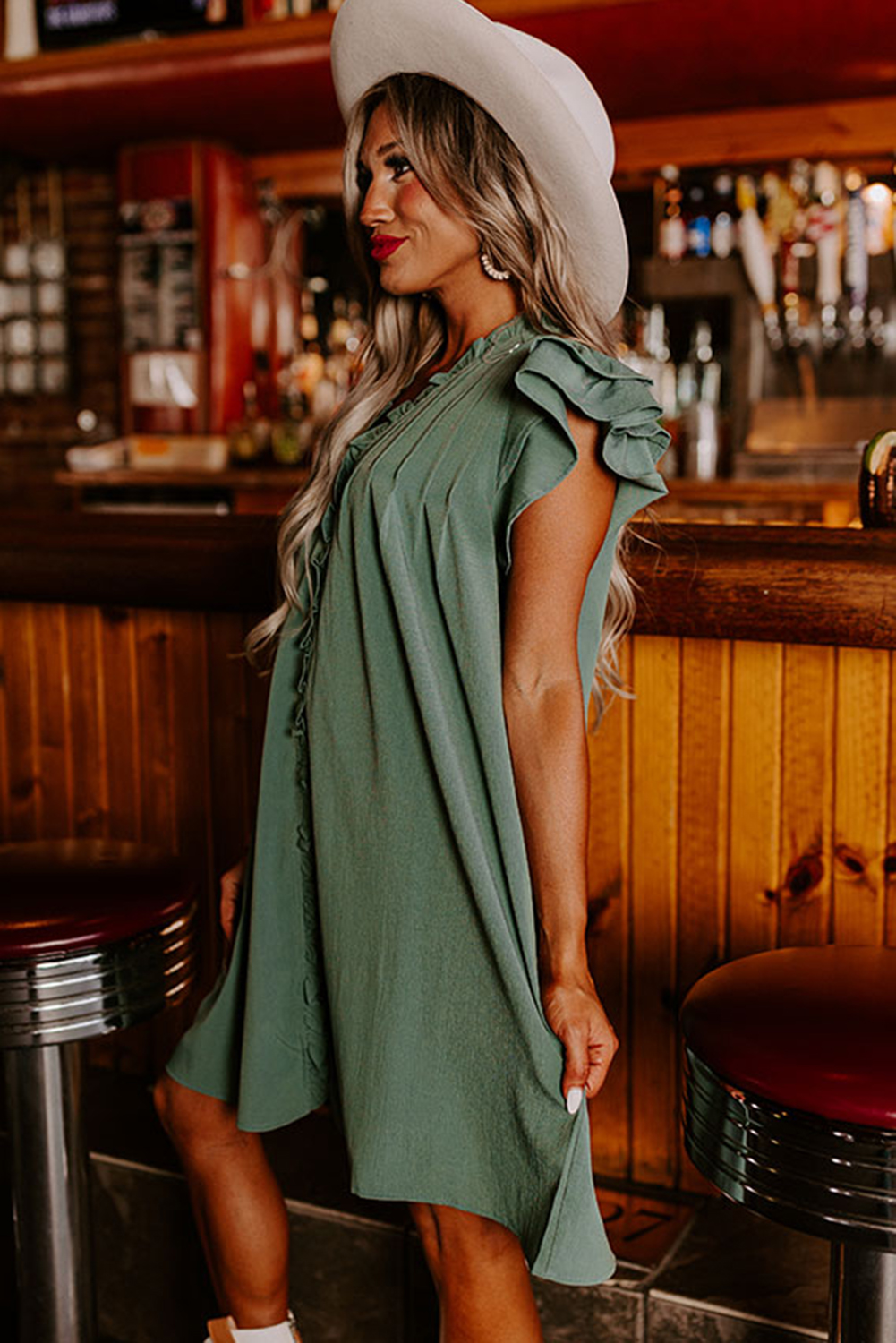 Elevate your summer wardrobe with this Women's Mist Green Ruffle Sleeve V-Neck Frilled Shift Dress. The plain mini dress features a frilled V-neck and cute ruffled sleeves, offering a sweet and romantic look. The shift cut and skin-friendly 100% polyester fabric ensure comfort even in hot weather, making it a perfect choice for daily wear. This dress can be easily paired with sandals, high heels, or flats for different occasions, offering a fashionable and versatile feel. Whether you're attending a casual daytime event or a special evening outing, this dress is a stylish and comfortable option. Embrace the season with this Mist Green Ruffle Sleeve Dress, a must-have for every fashion-forward woman. - Detail View 4 Elevate your summer wardrobe with this Women's Mist Green Ruffle Sleeve V-Neck Frilled Shift Dress. The plain mini dress features a frilled V-neck and cute ruffled sleeves, offering a sweet and romantic look. The shift cut and skin-friendly 100% polyester fabric ensure comfort even in hot weather, making it a perfect choice for daily wear. This dress can be easily paired with sandals, high heels, or flats for different occasions, offering a fashionable and versatile feel. Whether you're attending a casual daytime event or a special evening outing, this dress is a stylish and comfortable option. Embrace the season with this Mist Green Ruffle Sleeve Dress, a must-have for every fashion-forward woman. - Detail View 4