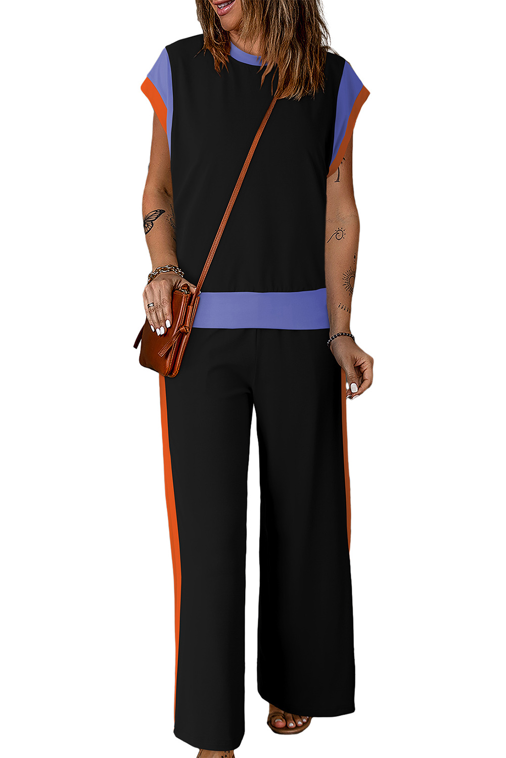Elevate your casual wardrobe with this fashionable Women's Black Color Block Casual Two-Piece Outfit. The eye-catching color block detail adds a trendy touch to this solid set, which includes a crew neck cap sleeve tee and crop wide leg pants. The loose fit and friendly design cater to most body shapes, providing comfort and style for everyday wear. Crafted from fine fabric, this outfit is perfect for warm weather, ensuring a stylish and comfortable experience. The high-waisted wide leg pants with pockets add functionality and flair to the ensemble. Ideal for casual occasions, this set is a hot-selling choice for women who appreciate chic and comfortable styles. - Detail View 9 Elevate your casual wardrobe with this fashionable Women's Black Color Block Casual Two-Piece Outfit. The eye-catching color block detail adds a trendy touch to this solid set, which includes a crew neck cap sleeve tee and crop wide leg pants. The loose fit and friendly design cater to most body shapes, providing comfort and style for everyday wear. Crafted from fine fabric, this outfit is perfect for warm weather, ensuring a stylish and comfortable experience. The high-waisted wide leg pants with pockets add functionality and flair to the ensemble. Ideal for casual occasions, this set is a hot-selling choice for women who appreciate chic and comfortable styles. - Detail View 9