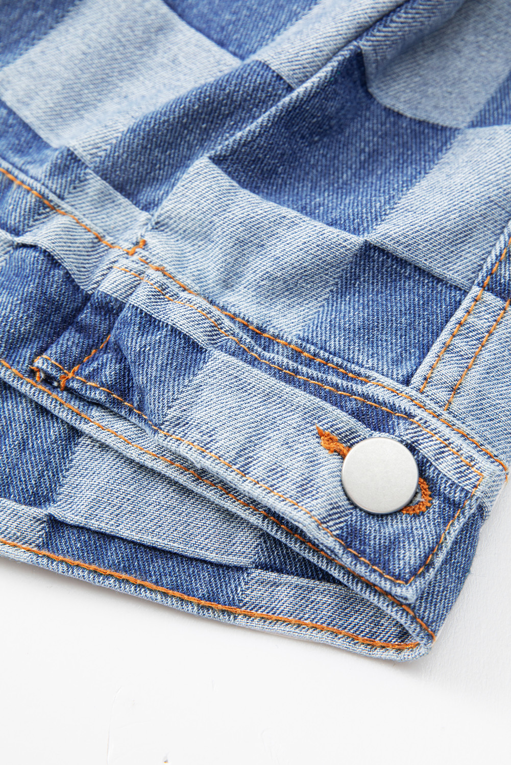 Elevate your casual style with this Women's Light Blue Checkered Patchwork Button-Up Denim Jacket. A unique fusion of classic denim and patchwork style, this jacket features a playful two-tone checkered pattern that adds a fun twist to the traditional denim look. The flap pockets and button-up front not only enhance the jacket's style but also provide practical functionality. Pair it with jeans for a trendy denim-on-denim look, or layer it over a simple tee for a laid-back and effortlessly cool ensemble. Made from a blend of 56% cotton and 44% polyester, this jacket offers both comfort and durability, making it ideal for the fall and autumn seasons. The long sleeves and turn-down collar add to the jacket's classic and timeless appeal. Show off your fashion taste with this stylish and versatile denim jacket. - Detail View 19 Elevate your casual style with this Women's Light Blue Checkered Patchwork Button-Up Denim Jacket. A unique fusion of classic denim and patchwork style, this jacket features a playful two-tone checkered pattern that adds a fun twist to the traditional denim look. The flap pockets and button-up front not only enhance the jacket's style but also provide practical functionality. Pair it with jeans for a trendy denim-on-denim look, or layer it over a simple tee for a laid-back and effortlessly cool ensemble. Made from a blend of 56% cotton and 44% polyester, this jacket offers both comfort and durability, making it ideal for the fall and autumn seasons. The long sleeves and turn-down collar add to the jacket's classic and timeless appeal. Show off your fashion taste with this stylish and versatile denim jacket. - Detail View 19