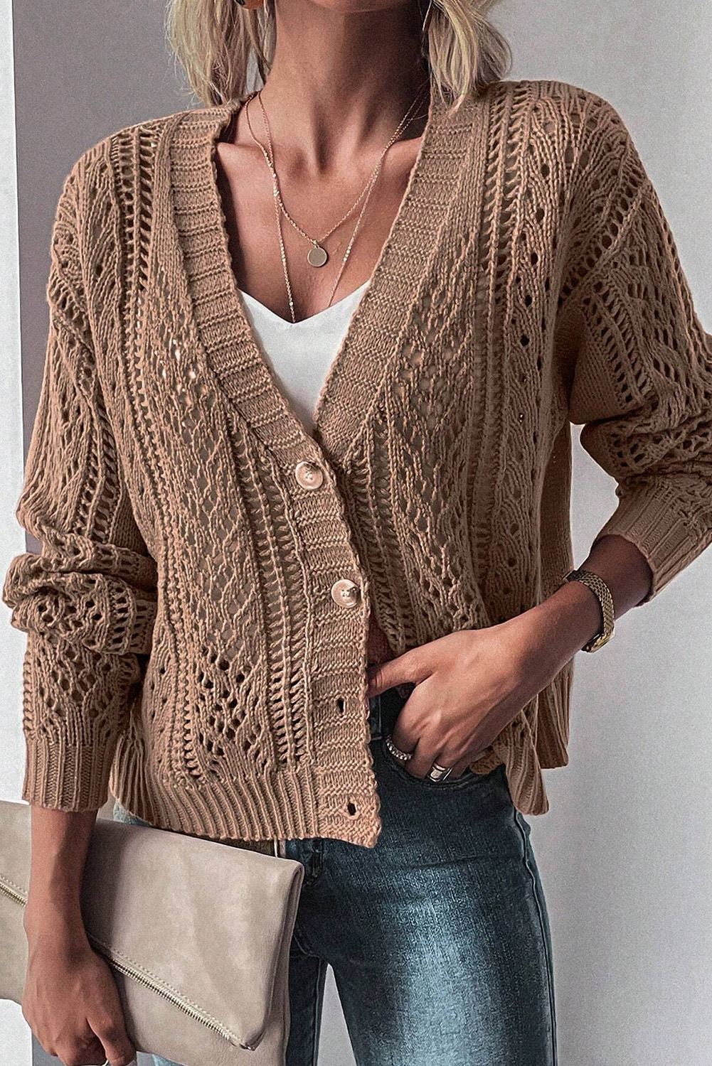 Elevate your winter wardrobe with this effortlessly stylish Women's Dark Khaki Open Knit Drop Shoulder Sweater Cardigan. The chic slouchy drop shoulder silhouette is loved by modern ladies for its relaxed and fashionable look. Made from a soft and cozy blend of 60% cotton and 40% acrylic, this sweater cardigan ensures all-day comfort and is perfect for various occasions. The open knit design adds a touch of grace to the sweater, while the V-neckline and button details make it a versatile piece for layering. The dark khaki color is a timeless choice, easy to pair with different outfits. Stay warm and fashionable on chilly days with this modern and chic cardigan, a must-have addition to your winter wardrobe. - Detail View 4 Elevate your winter wardrobe with this effortlessly stylish Women's Dark Khaki Open Knit Drop Shoulder Sweater Cardigan. The chic slouchy drop shoulder silhouette is loved by modern ladies for its relaxed and fashionable look. Made from a soft and cozy blend of 60% cotton and 40% acrylic, this sweater cardigan ensures all-day comfort and is perfect for various occasions. The open knit design adds a touch of grace to the sweater, while the V-neckline and button details make it a versatile piece for layering. The dark khaki color is a timeless choice, easy to pair with different outfits. Stay warm and fashionable on chilly days with this modern and chic cardigan, a must-have addition to your winter wardrobe. - Detail View 4