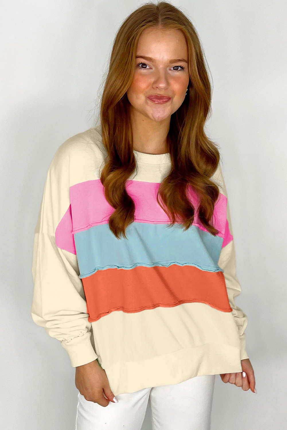Elevate your casual style with this Women's White Colorblock Patchwork Crewneck Sweatshirt. The eye-catching colorblock patchwork design makes a statement, while the stylish drop shoulders add a trendy touch. Long sleeves provide warmth and comfort, perfect for daily wear. This sweatshirt is made from a soft blend of 70% polyester and 30% cotton, ensuring a comfortable fit and easy movement. The round neck and shift silhouette add a relaxed and effortless look. Pair it with leggings or jeans for a chic and casual outfit. This sweatshirt is a must-have for your daily wardrobe, featuring delicate cuttings and attractive prices. - Detail View 4 Elevate your casual style with this Women's White Colorblock Patchwork Crewneck Sweatshirt. The eye-catching colorblock patchwork design makes a statement, while the stylish drop shoulders add a trendy touch. Long sleeves provide warmth and comfort, perfect for daily wear. This sweatshirt is made from a soft blend of 70% polyester and 30% cotton, ensuring a comfortable fit and easy movement. The round neck and shift silhouette add a relaxed and effortless look. Pair it with leggings or jeans for a chic and casual outfit. This sweatshirt is a must-have for your daily wardrobe, featuring delicate cuttings and attractive prices. - Detail View 4