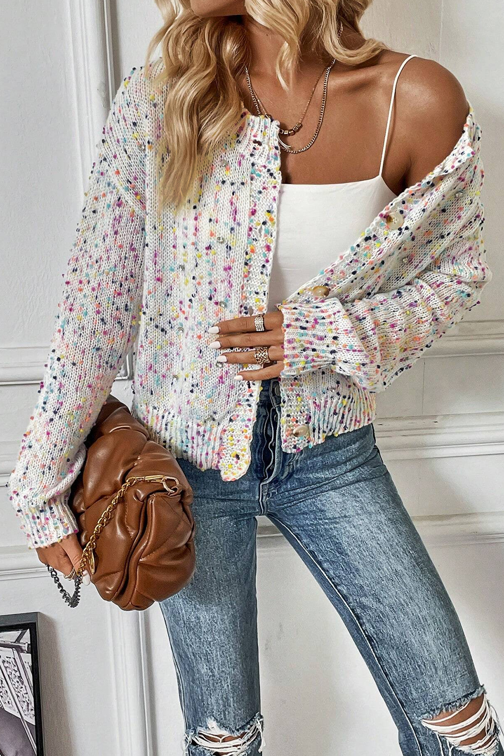 Elevate your winter wardrobe with this Women's White Multicolor Confetti Sweater Cardigan. The sweet and stylish multicolor confetti pattern adds a playful touch to the cardigan, making it a trendy and eye-catching piece. The sweater style with button front closure is easy to dress up or down, offering versatility for various occasions. Its flattering fit is designed to showcase your figure in a flattering way, making you feel confident in public. Made from a premium blend of 43% cotton, 29% acrylic, 22% polyester, and 6% polyamide, this cardigan ensures both comfort and durability. The white color and solid pattern make it easy to pair with jeans and skirts, creating a chic and fashionable look. This cardigan is a must-have for the coming fall, offering the latest fashion trends and ensuring you stay cozy and stylish. - Detail View 4 Elevate your winter wardrobe with this Women's White Multicolor Confetti Sweater Cardigan. The sweet and stylish multicolor confetti pattern adds a playful touch to the cardigan, making it a trendy and eye-catching piece. The sweater style with button front closure is easy to dress up or down, offering versatility for various occasions. Its flattering fit is designed to showcase your figure in a flattering way, making you feel confident in public. Made from a premium blend of 43% cotton, 29% acrylic, 22% polyester, and 6% polyamide, this cardigan ensures both comfort and durability. The white color and solid pattern make it easy to pair with jeans and skirts, creating a chic and fashionable look. This cardigan is a must-have for the coming fall, offering the latest fashion trends and ensuring you stay cozy and stylish. - Detail View 4