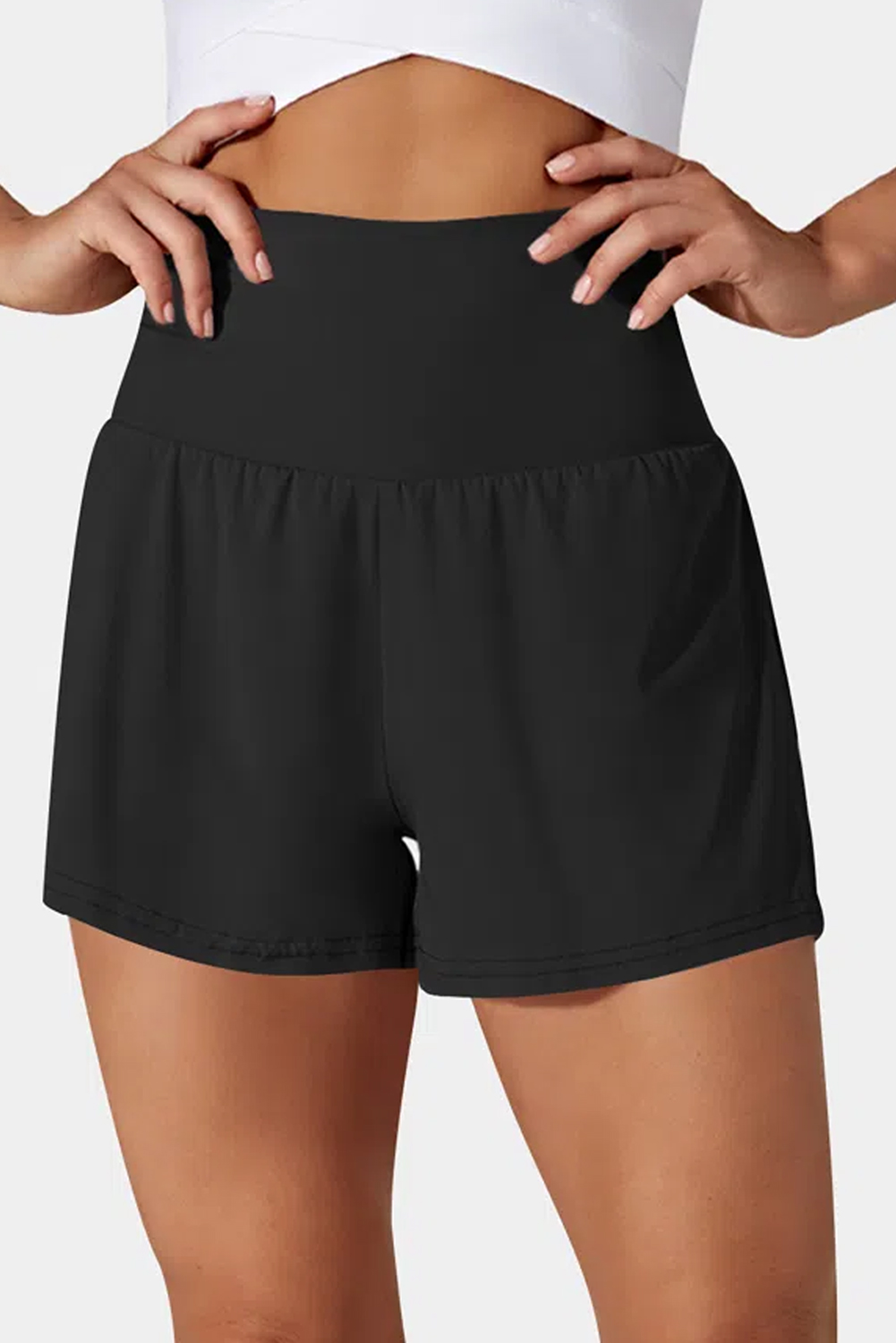 Elevate your beach look with these Women's Black Pocketed Wide Waistband Swim Shorts. The solid color adds a sleek and versatile element to your swimwear collection, offering a chic and casual style for your beach outings. The invisible pocket provides a convenient and secure storage solution for your essentials, while the wide waistband ensures both comfort and style. Made from high-quality quick-dry fabric, these swim shorts offer a comfortable and practical experience, perfect for the summer season. With a shift silhouette and high waistline, these swim bottoms are the perfect combo of chic and casual, making them a must-have for your beach wardrobe. - Detail View 4 Elevate your beach look with these Women's Black Pocketed Wide Waistband Swim Shorts. The solid color adds a sleek and versatile element to your swimwear collection, offering a chic and casual style for your beach outings. The invisible pocket provides a convenient and secure storage solution for your essentials, while the wide waistband ensures both comfort and style. Made from high-quality quick-dry fabric, these swim shorts offer a comfortable and practical experience, perfect for the summer season. With a shift silhouette and high waistline, these swim bottoms are the perfect combo of chic and casual, making them a must-have for your beach wardrobe. - Detail View 4