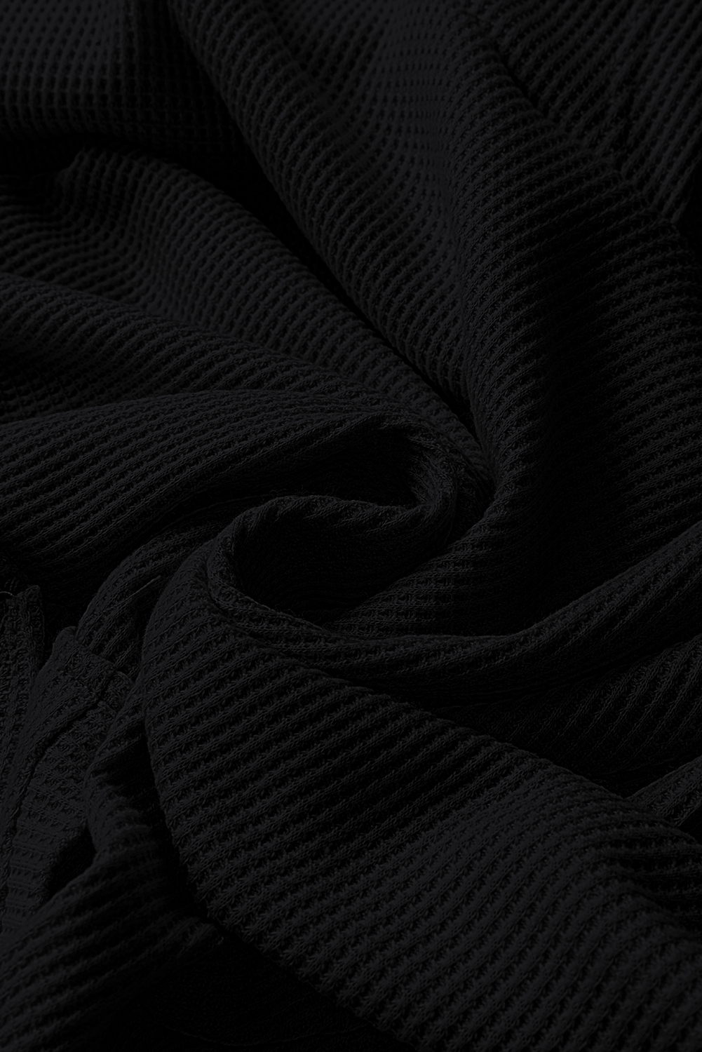 Elevate your casual style with this Women's Black Waffle Knit Fleece Lined High-Low Oversized Hoodie. The soft jacquard knit fabric creates a cozy feel, perfect for the colder seasons. The stylish high-low design and oversized fit enhance a casual and slender silhouette, while the outstanding fleece lining provides warmth and comfort. The convenient kangaroo pocket not only offers storage but also adds a decorative element to the hoodie. Made from a blend of 75% polyester and 25% cotton, this hoodie ensures durability and a comfortable fit. The solid black color and hooded neckline make it a versatile addition to your fall and winter wardrobe. Perfect for daily wear, this hoodie is a must-have for staying warm and stylish during the colder months. - Detail View 14 Elevate your casual style with this Women's Black Waffle Knit Fleece Lined High-Low Oversized Hoodie. The soft jacquard knit fabric creates a cozy feel, perfect for the colder seasons. The stylish high-low design and oversized fit enhance a casual and slender silhouette, while the outstanding fleece lining provides warmth and comfort. The convenient kangaroo pocket not only offers storage but also adds a decorative element to the hoodie. Made from a blend of 75% polyester and 25% cotton, this hoodie ensures durability and a comfortable fit. The solid black color and hooded neckline make it a versatile addition to your fall and winter wardrobe. Perfect for daily wear, this hoodie is a must-have for staying warm and stylish during the colder months. - Detail View 14