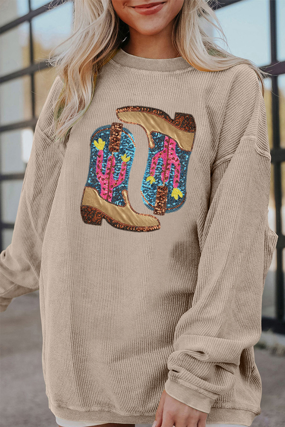 Ride into comfort with this Women's Smoke Gray Cowboy Boots Graphic Corded Loose Fit Sweatshirt. This stylish sweatshirt features a premium corded fabric that adds texture and a cozy feel, making it perfect for daily wear. The western-style cowboy boots graphic print brings a touch of the wild west, adding a dash of excitement to your outfit. The loose fit design ensures ease of movement and comfort, making it ideal for casual wear. Pair it with your favorite denim or casual wear for a laid-back look. Whether you're heading out or just lounging around, this graphic sweatshirt is the perfect companion for your daily adventures. - Detail View 4 Ride into comfort with this Women's Smoke Gray Cowboy Boots Graphic Corded Loose Fit Sweatshirt. This stylish sweatshirt features a premium corded fabric that adds texture and a cozy feel, making it perfect for daily wear. The western-style cowboy boots graphic print brings a touch of the wild west, adding a dash of excitement to your outfit. The loose fit design ensures ease of movement and comfort, making it ideal for casual wear. Pair it with your favorite denim or casual wear for a laid-back look. Whether you're heading out or just lounging around, this graphic sweatshirt is the perfect companion for your daily adventures. - Detail View 4