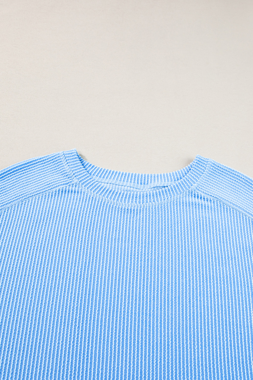 Stay comfortable and stylish with this Light Blue Plus Size Ribbed Long Sleeve Top and Drawstring Shorts Set. The solid color design and ribbed texture add visual interest, allowing you to easily mix and match with other pieces in your wardrobe. The long sleeve top is perfect for layering during cooler weather or evenings, while the drawstring shorts provide a comfortable and adjustable fit. This plus size loungewear set is the perfect combination of chic and casual, making it ideal for daily wear. Pair it with sneakers or sandals for a relaxed outfit, or dress it up with heels for a more elegant look. - Detail View 9 Stay comfortable and stylish with this Light Blue Plus Size Ribbed Long Sleeve Top and Drawstring Shorts Set. The solid color design and ribbed texture add visual interest, allowing you to easily mix and match with other pieces in your wardrobe. The long sleeve top is perfect for layering during cooler weather or evenings, while the drawstring shorts provide a comfortable and adjustable fit. This plus size loungewear set is the perfect combination of chic and casual, making it ideal for daily wear. Pair it with sneakers or sandals for a relaxed outfit, or dress it up with heels for a more elegant look. - Detail View 9