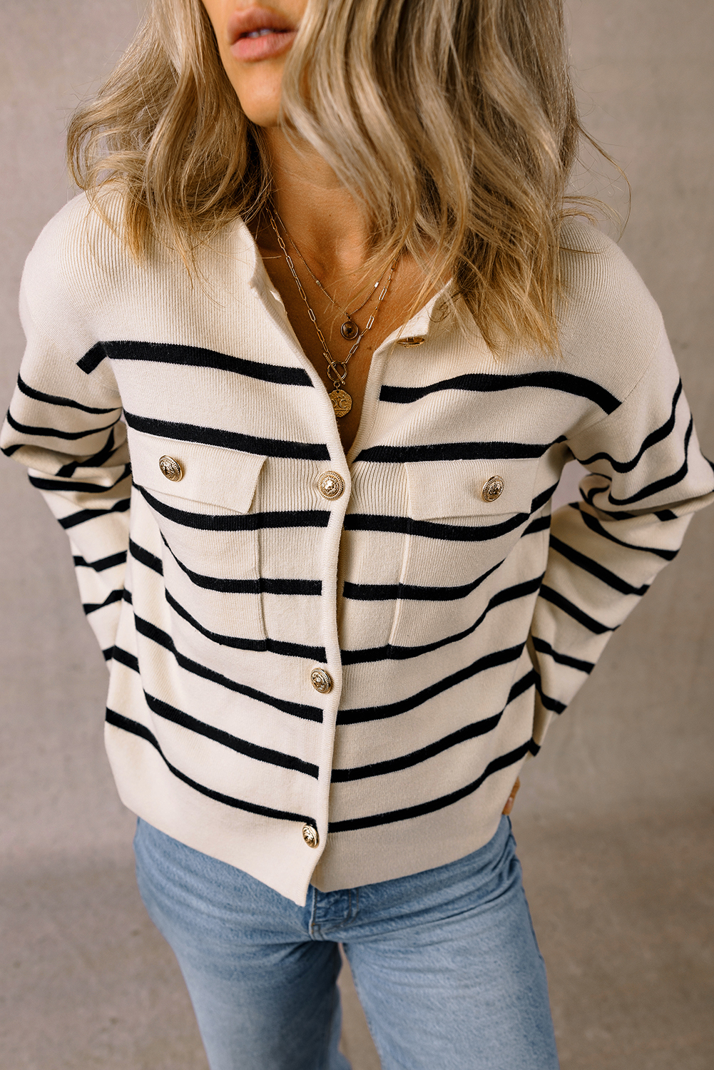 Make a statement with this Women's Classic Black Stripe Flap Pocket Buttoned Cardigan Sweater. The classic striped pattern adds a timeless touch, while the flap pockets provide both style and functionality. The buttoned front allows for easy fastening and an adjustable fit, making it perfect for ladies of all ages. Pair it with your favorite pants or skirts for a chic and elegant look. This cardigan is a must-have addition to your winter wardrobe, offering both modernity and timelessness. - Detail View 4 Make a statement with this Women's Classic Black Stripe Flap Pocket Buttoned Cardigan Sweater. The classic striped pattern adds a timeless touch, while the flap pockets provide both style and functionality. The buttoned front allows for easy fastening and an adjustable fit, making it perfect for ladies of all ages. Pair it with your favorite pants or skirts for a chic and elegant look. This cardigan is a must-have addition to your winter wardrobe, offering both modernity and timelessness. - Detail View 4