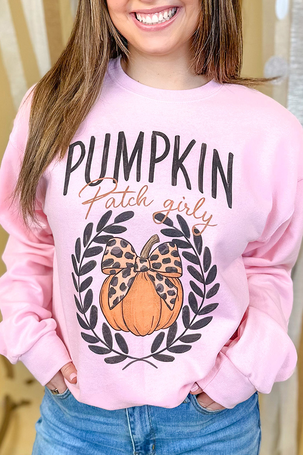 Festive Halloween Sweatshirt: Pink Leopard Print with Bowknot Detail - Detail View 2 Festive Halloween Sweatshirt: Pink Leopard Print with Bowknot Detail - Detail View 2