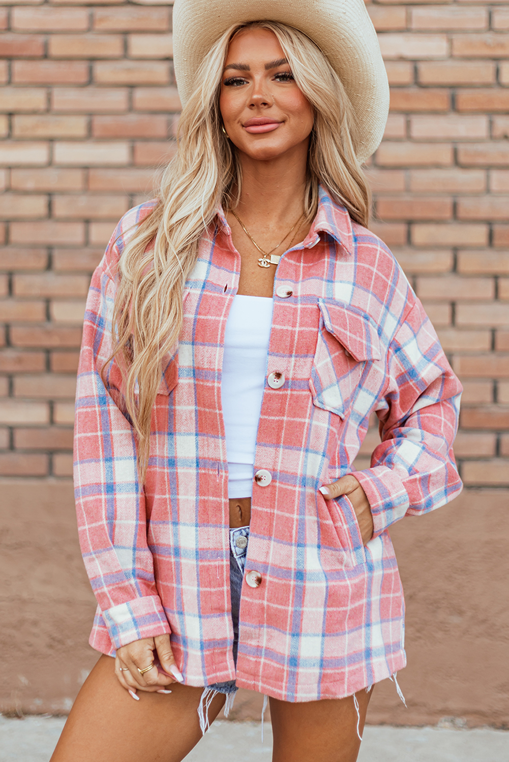 Stay stylish and comfortable in the early autumn with this Women's Pink Plaid Flap Pocket Button Up Shacket. The classic plaid design adds a touch of timeless charm to your outfit, while the convenient flap pockets provide storage for your essentials. Made from premium 100% polyester, this shacket is lightweight yet provides an extra layer of warmth for cool days. The versatile button-up style allows you to create a casual yet put-together look effortlessly. The pink color adds a feminine and chic touch to the shacket, making it an ideal choice for the fall and autumn season. Pair it with jeans and boots for a trendy and cozy ensemble. This shacket is a must-have addition to your daily wardrobe, offering both style and functionality. - Detail View 4 Stay stylish and comfortable in the early autumn with this Women's Pink Plaid Flap Pocket Button Up Shacket. The classic plaid design adds a touch of timeless charm to your outfit, while the convenient flap pockets provide storage for your essentials. Made from premium 100% polyester, this shacket is lightweight yet provides an extra layer of warmth for cool days. The versatile button-up style allows you to create a casual yet put-together look effortlessly. The pink color adds a feminine and chic touch to the shacket, making it an ideal choice for the fall and autumn season. Pair it with jeans and boots for a trendy and cozy ensemble. This shacket is a must-have addition to your daily wardrobe, offering both style and functionality. - Detail View 4