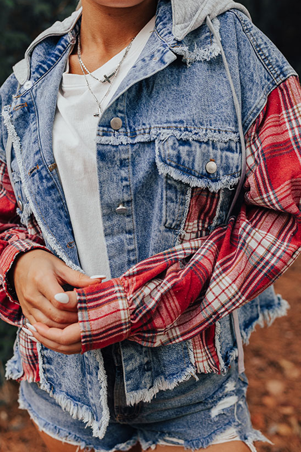 Make a unique fashion statement with this Women's Beau Blue Plaid Patchwork Hooded Raw Hem Denim Jacket. Embrace a trendy and casual style with the plaid patchwork design that adds a touch of creativity to your outfit. The distressed raw hem details create a vintage look, exuding a laid-back and fashionable vibe. This hooded denim jacket, made from a premium blend of 83% cotton and 17% polyester, ensures both style and durability. Perfect for daily wear, this jacket pairs effortlessly with a t-shirt and jeans for a relaxed and stylish ensemble. Stand out from the crowd with this fashionable denim jacket that combines comfort and style in one versatile piece. - Detail View 9 Make a unique fashion statement with this Women's Beau Blue Plaid Patchwork Hooded Raw Hem Denim Jacket. Embrace a trendy and casual style with the plaid patchwork design that adds a touch of creativity to your outfit. The distressed raw hem details create a vintage look, exuding a laid-back and fashionable vibe. This hooded denim jacket, made from a premium blend of 83% cotton and 17% polyester, ensures both style and durability. Perfect for daily wear, this jacket pairs effortlessly with a t-shirt and jeans for a relaxed and stylish ensemble. Stand out from the crowd with this fashionable denim jacket that combines comfort and style in one versatile piece. - Detail View 9