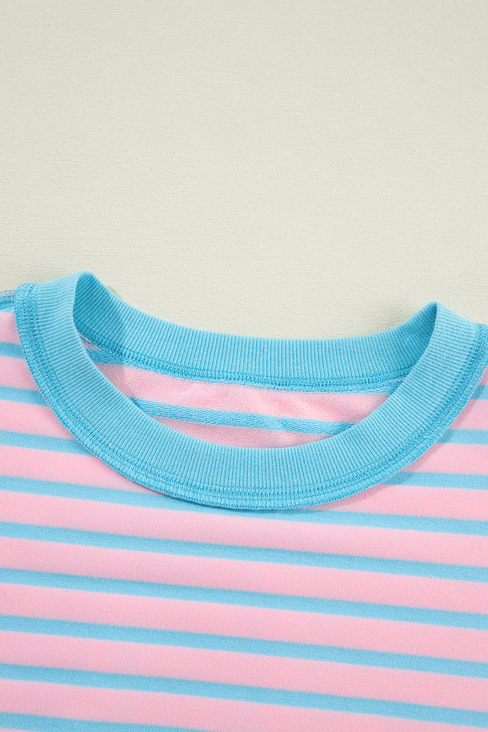 Add a touch of modernity and trendiness to your wardrobe with this Women's Pink Stripe Contrast Trim High-Low Pullover Tunic Sweatshirt. The stylish contrast trim detailing adds a pop of color and style, making it a standout piece in your collection. Designed with a flattering tunic length, this sweatshirt offers a versatile and comfortable fit, perfect for daily wear. The classic crew neck design provides a timeless and casual appeal, suitable for various occasions. Made from a premium blend of 70% polyester, 25% cotton, and 5% elastane, this sweatshirt ensures both comfort and durability. The pink stripe pattern and colorblock details exude a chic and fashionable vibe, elevating your personal style effortlessly. Pair it with your favorite jeans or leggings for a cozy and stylish look in the fall and autumn season. - Detail View 14 Add a touch of modernity and trendiness to your wardrobe with this Women's Pink Stripe Contrast Trim High-Low Pullover Tunic Sweatshirt. The stylish contrast trim detailing adds a pop of color and style, making it a standout piece in your collection. Designed with a flattering tunic length, this sweatshirt offers a versatile and comfortable fit, perfect for daily wear. The classic crew neck design provides a timeless and casual appeal, suitable for various occasions. Made from a premium blend of 70% polyester, 25% cotton, and 5% elastane, this sweatshirt ensures both comfort and durability. The pink stripe pattern and colorblock details exude a chic and fashionable vibe, elevating your personal style effortlessly. Pair it with your favorite jeans or leggings for a cozy and stylish look in the fall and autumn season. - Detail View 14