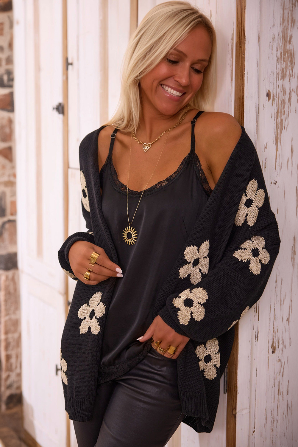 Add a touch of feminine charm to your wardrobe with this Women's Black Floral Print Knitted Open Front Loose Cardigan. The knitted construction ensures warmth and comfort, while the open front design allows for easy layering and styling. The tunic length provides added coverage and versatility, making it perfect for daily wear. The cardigan's casual yet chic design strikes the perfect balance between relaxation and elegance. The floral print adds a vintage touch, making it suitable for fall and autumn occasions. Made from a soft blend of 55% acrylic and 45% cotton, this cardigan is a must-have for any woman's wardrobe. - Detail View 9 Add a touch of feminine charm to your wardrobe with this Women's Black Floral Print Knitted Open Front Loose Cardigan. The knitted construction ensures warmth and comfort, while the open front design allows for easy layering and styling. The tunic length provides added coverage and versatility, making it perfect for daily wear. The cardigan's casual yet chic design strikes the perfect balance between relaxation and elegance. The floral print adds a vintage touch, making it suitable for fall and autumn occasions. Made from a soft blend of 55% acrylic and 45% cotton, this cardigan is a must-have for any woman's wardrobe. - Detail View 9