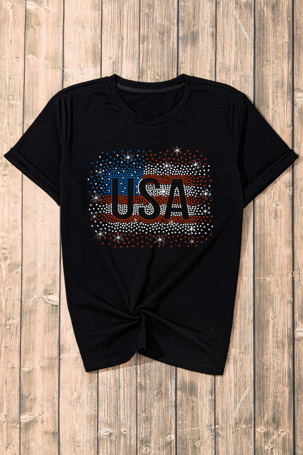 Make a statement with this Women's Stylish Black Rhinestone USA Flag Graphic T-Shirt. The sparkling rhinestones on the America flag graphic add a glamorous touch to your outfit, perfect for elevating your casual look. With a versatile crew neck and short sleeves, this tee is ideal for pairing with jeans or denim shorts for a trendy ensemble. Crafted from a blend of 62% polyester, 32% cotton, and 6% elastane, this tee offers a comfortable and stylish wear during the summer season. The black color adds a chic and edgy vibe to your outfit, making it a must-have piece for your wardrobe. Embrace your patriotic spirit with this eye-catching graphic tee and stand out from the crowd. - Detail View 9 Make a statement with this Women's Stylish Black Rhinestone USA Flag Graphic T-Shirt. The sparkling rhinestones on the America flag graphic add a glamorous touch to your outfit, perfect for elevating your casual look. With a versatile crew neck and short sleeves, this tee is ideal for pairing with jeans or denim shorts for a trendy ensemble. Crafted from a blend of 62% polyester, 32% cotton, and 6% elastane, this tee offers a comfortable and stylish wear during the summer season. The black color adds a chic and edgy vibe to your outfit, making it a must-have piece for your wardrobe. Embrace your patriotic spirit with this eye-catching graphic tee and stand out from the crowd. - Detail View 9