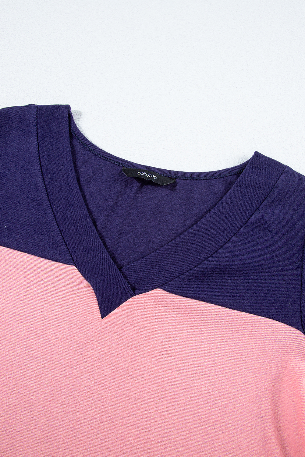 Elevate your wardrobe with this stylish Women's Blue Stripe Colorblock Long Sleeve V Neck Top. The V neck design offers a sophisticated and slimming effect, while the colorblocking adds a dynamic visual appeal, making this top a standout piece. The button decor on the sleeves brings a touch of elegance and adds a twist to the overall design. Made from a comfortable blend of 75% polyester, 20% viscose, and 5% elastane, this top is ideal for daily wear and layering in cooler fall and autumn weather. The long sleeves provide added warmth and versatility, allowing you to create different looks. Pair this casual top with your favorite jeans or leggings for a chic and trendy ensemble. Add this must-have top to your collection for a fashionable and comfortable everyday style. - Detail View 9 Elevate your wardrobe with this stylish Women's Blue Stripe Colorblock Long Sleeve V Neck Top. The V neck design offers a sophisticated and slimming effect, while the colorblocking adds a dynamic visual appeal, making this top a standout piece. The button decor on the sleeves brings a touch of elegance and adds a twist to the overall design. Made from a comfortable blend of 75% polyester, 20% viscose, and 5% elastane, this top is ideal for daily wear and layering in cooler fall and autumn weather. The long sleeves provide added warmth and versatility, allowing you to create different looks. Pair this casual top with your favorite jeans or leggings for a chic and trendy ensemble. Add this must-have top to your collection for a fashionable and comfortable everyday style. - Detail View 9
