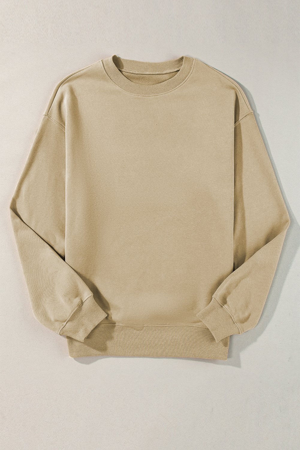 Stay stylish and cozy with this Women's Parchment Solid Loose Crew Neck Fleece Sweatshirt. The concise and chic design of this sweatshirt offers a versatile and trendy look. Its loose fit is suitable for most silhouettes, providing comfort and ease of movement. The crew neck, drop shoulder, and thigh-high length add a touch of casual and relaxed vibes to the sweatshirt. Made from a premium blend of 50% polyester and 50% cotton, it is very soft, warm, and features a fleece lining for added comfort and insulation. This solid color sweatshirt is a perfect choice for daily wear, especially during the winter season. The fine quality and attractive prices make it a must-have addition to your wardrobe. - Detail View 9 Stay stylish and cozy with this Women's Parchment Solid Loose Crew Neck Fleece Sweatshirt. The concise and chic design of this sweatshirt offers a versatile and trendy look. Its loose fit is suitable for most silhouettes, providing comfort and ease of movement. The crew neck, drop shoulder, and thigh-high length add a touch of casual and relaxed vibes to the sweatshirt. Made from a premium blend of 50% polyester and 50% cotton, it is very soft, warm, and features a fleece lining for added comfort and insulation. This solid color sweatshirt is a perfect choice for daily wear, especially during the winter season. The fine quality and attractive prices make it a must-have addition to your wardrobe. - Detail View 9